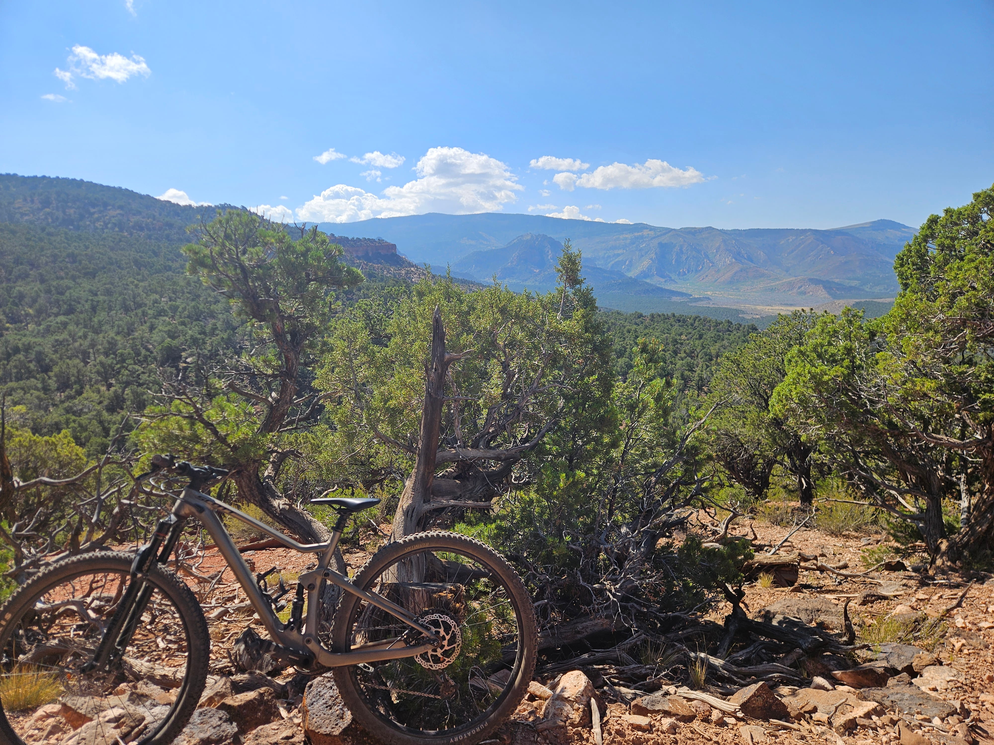 Mountain biking Iron Hills Trail System in Southern Utah with red rock cliffs and desert singletrack scenery