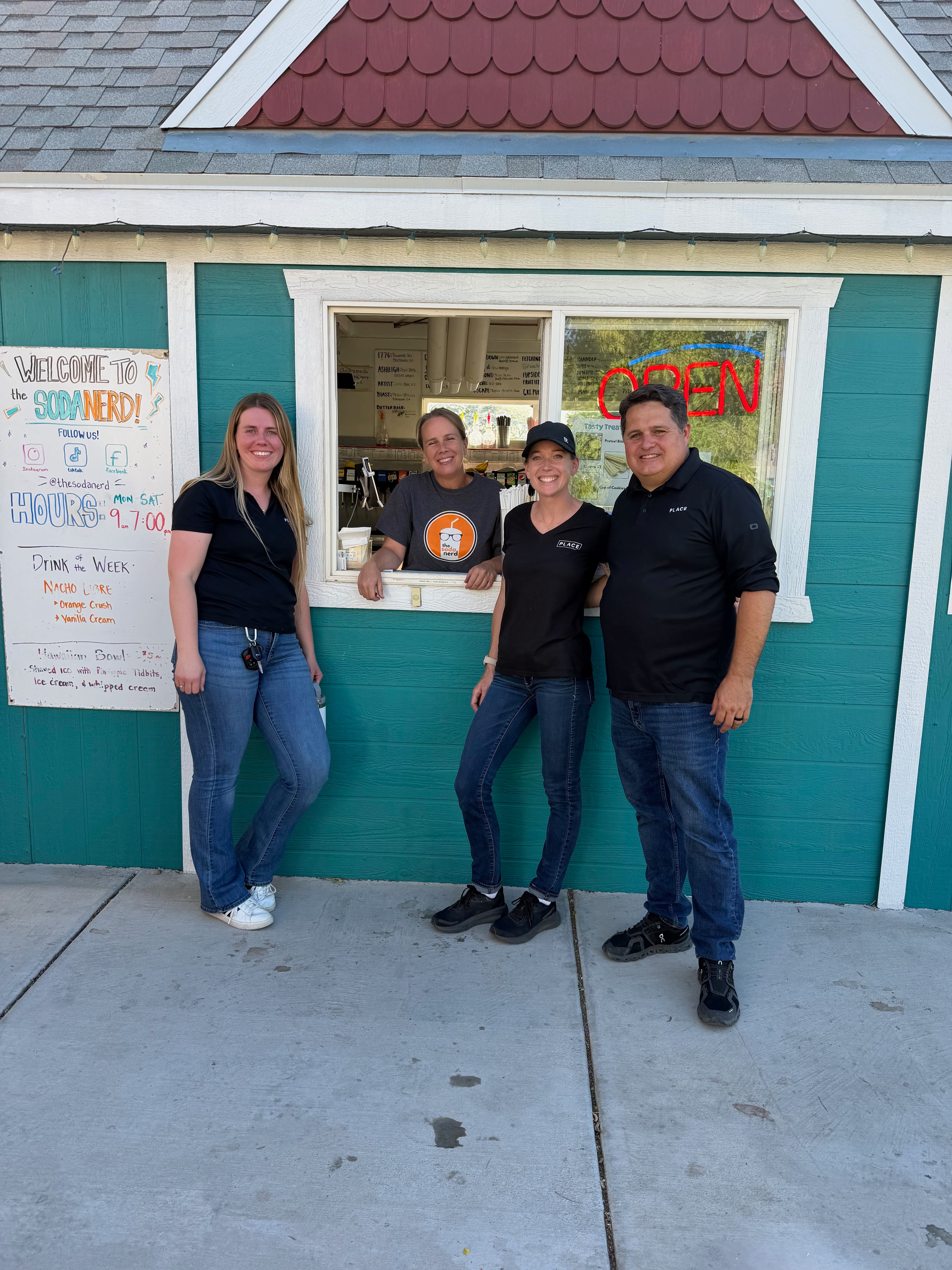 Families and children enjoying snow cones and outdoor community event in Cedar City Southern Utah real estate celebration