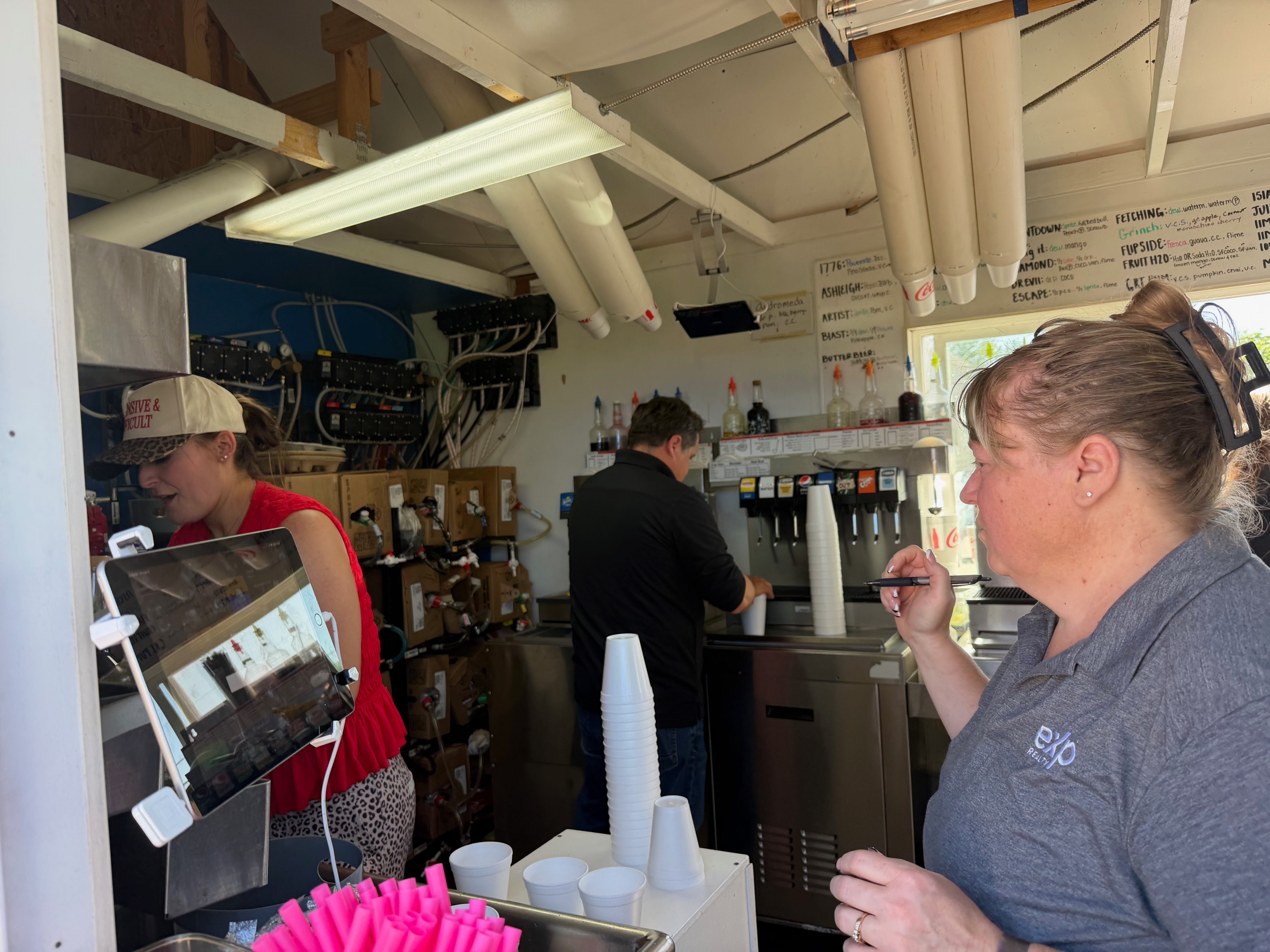 Real estate agents serving custom sodas at Soda Nerd customer appreciation day in Cedar City Utah