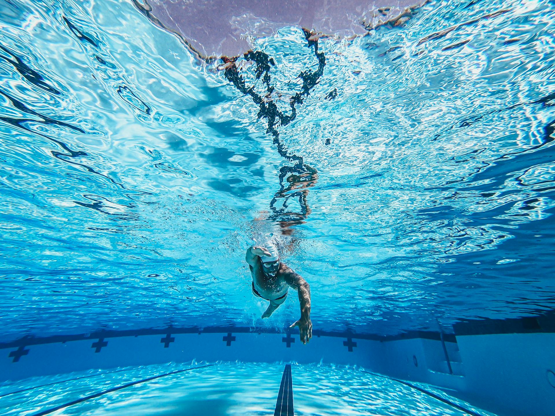 Photo by Kindel Media: https://www.pexels.com/photo/photo-of-an-athlete-swimming-underwater-8688566/
