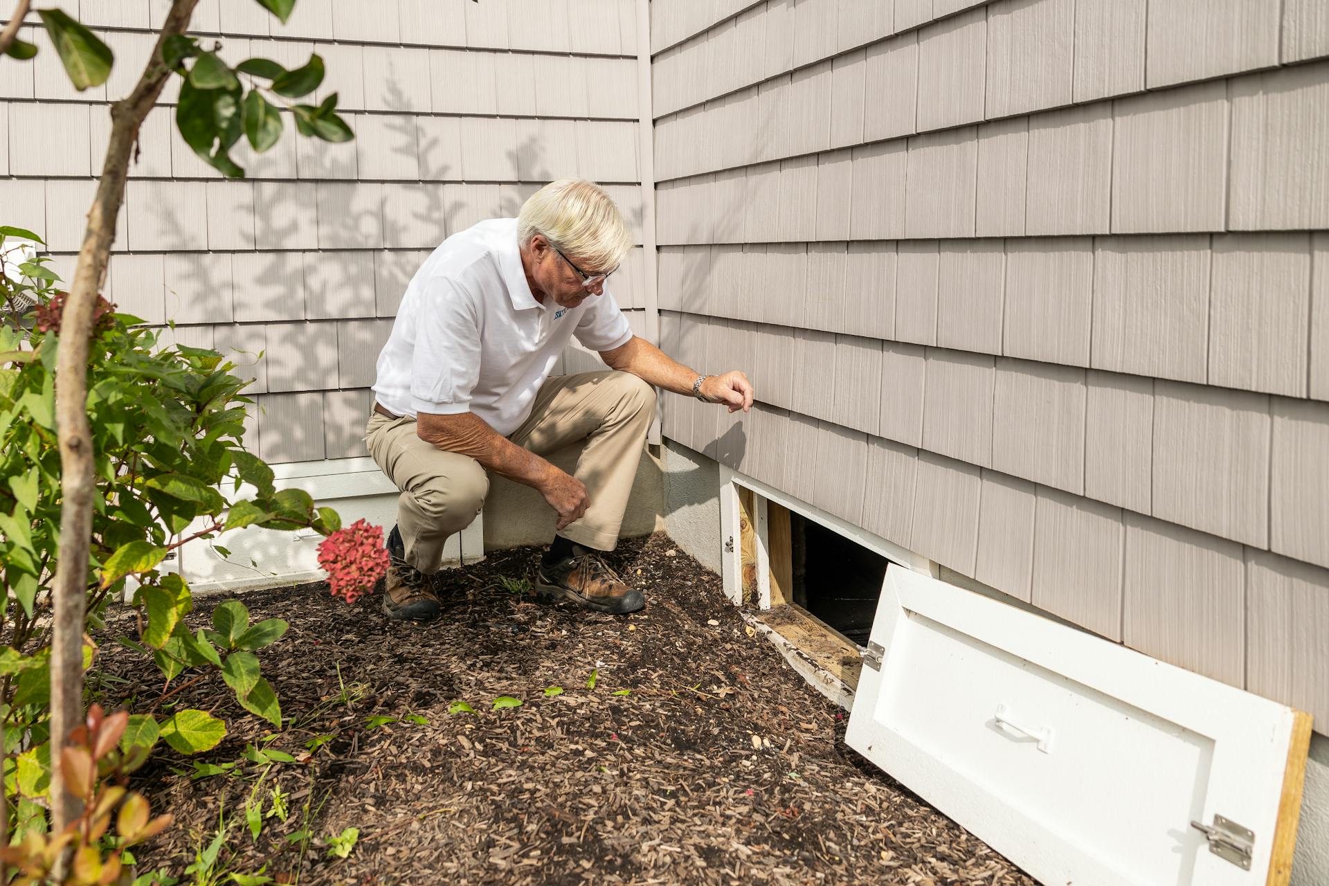Photo by Kathleen Austin Kuhn: https://www.pexels.com/photo/home-inspector-examining-crawl-space-outdoors-32497163/