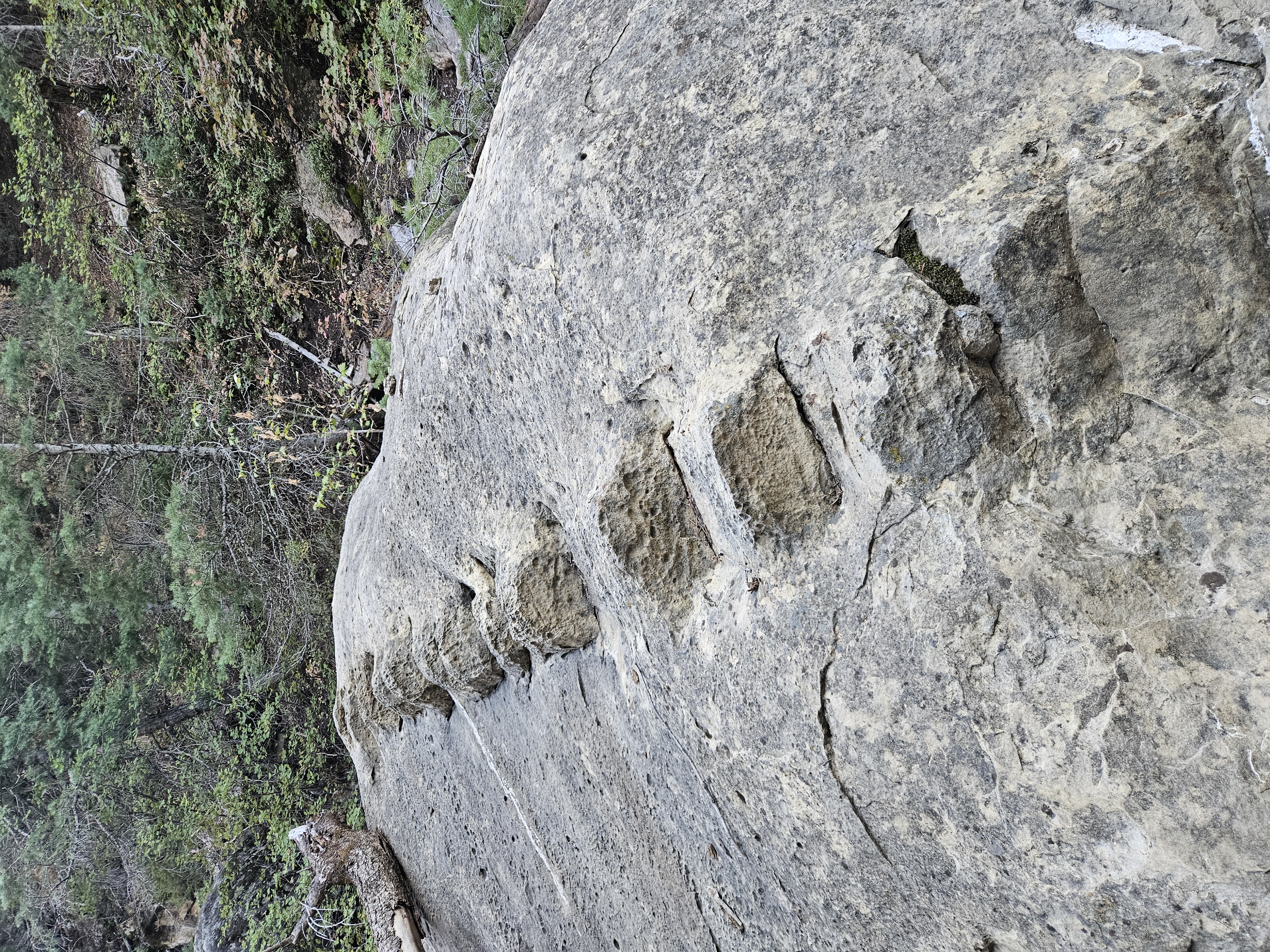 Narrow sandstone wash with steep canyon walls and rocky scramble sections in Southern Utah desert terrain