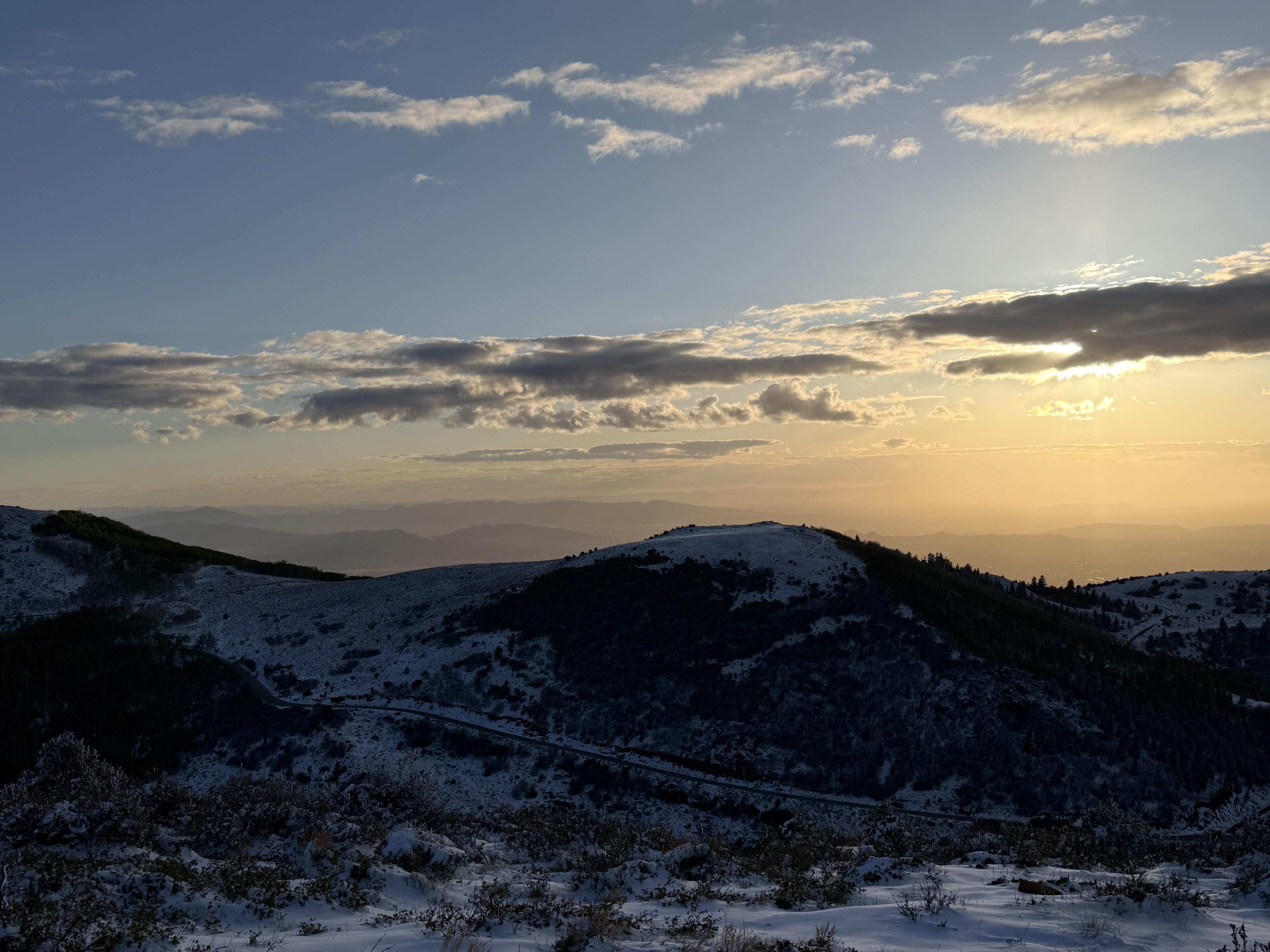 Snow-covered ridges and valley views above Cedar City after a May snowstorm