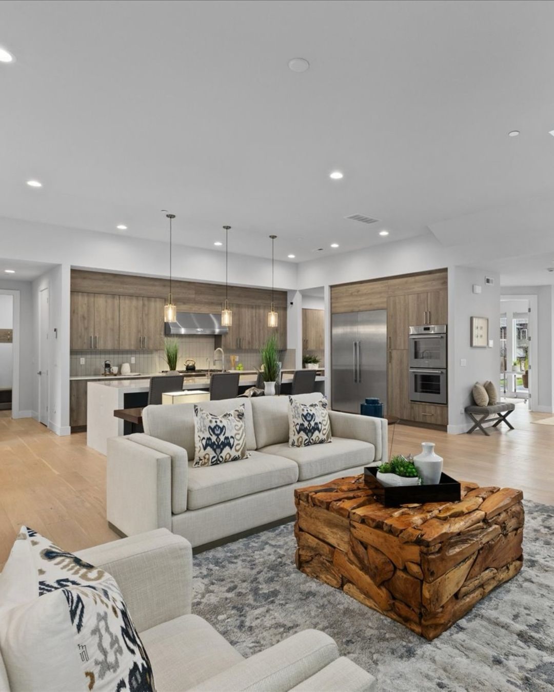 Luxury Kirkland home with bifold doors opening to covered outdoor living space