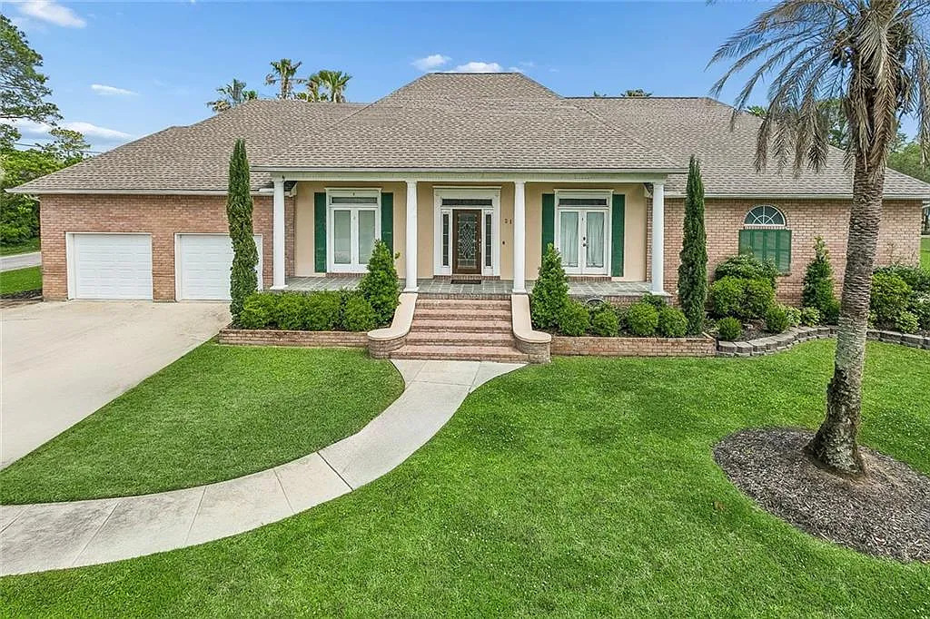 Pool, Private Dock & Boathouse — This $580K Slidell Waterfront Home in Bayou Bonfouca Is Built for the Louisiana Good Life header image.
