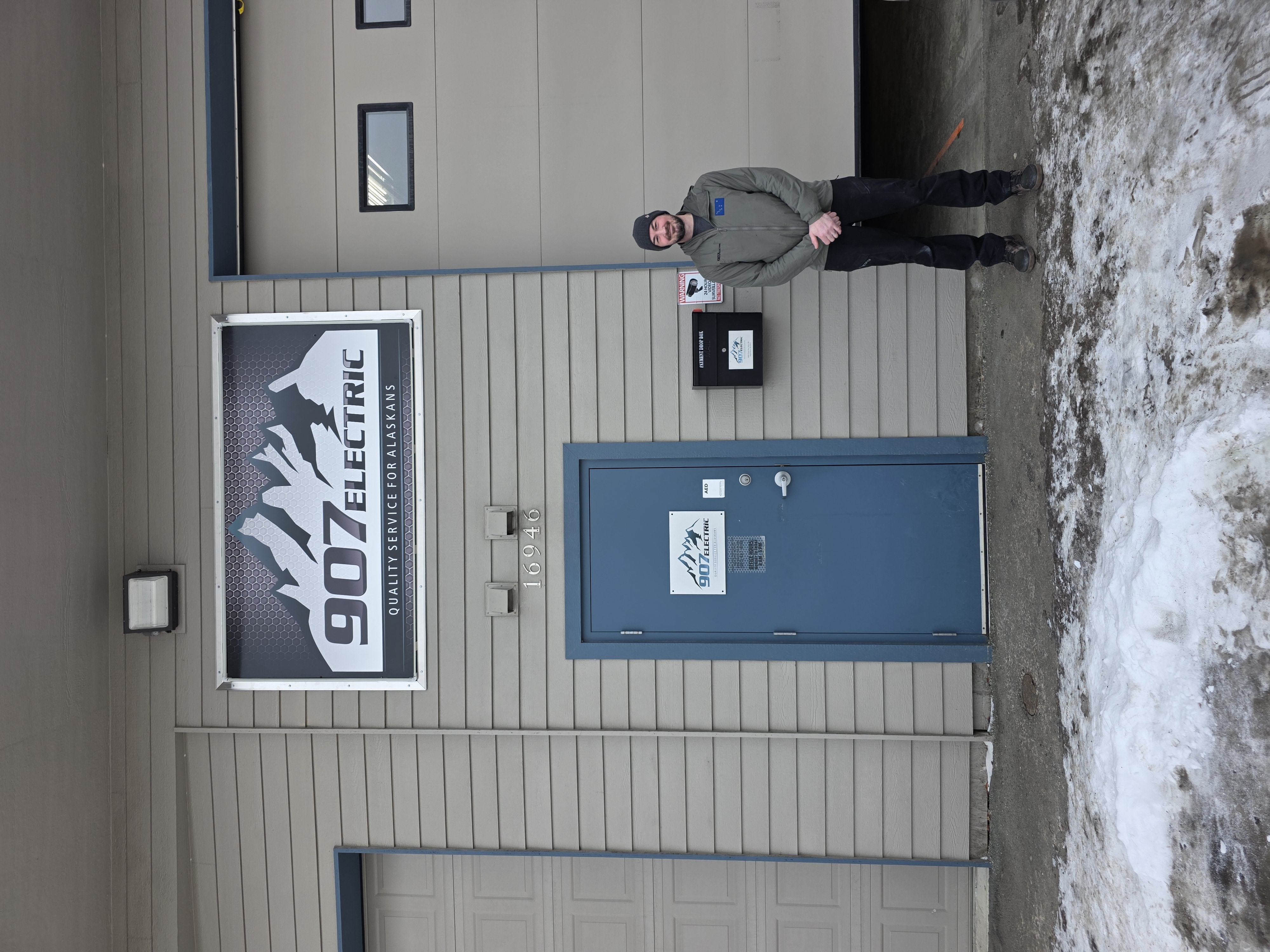 Owner Everett Taylor Standing in front of his business 907 Electric