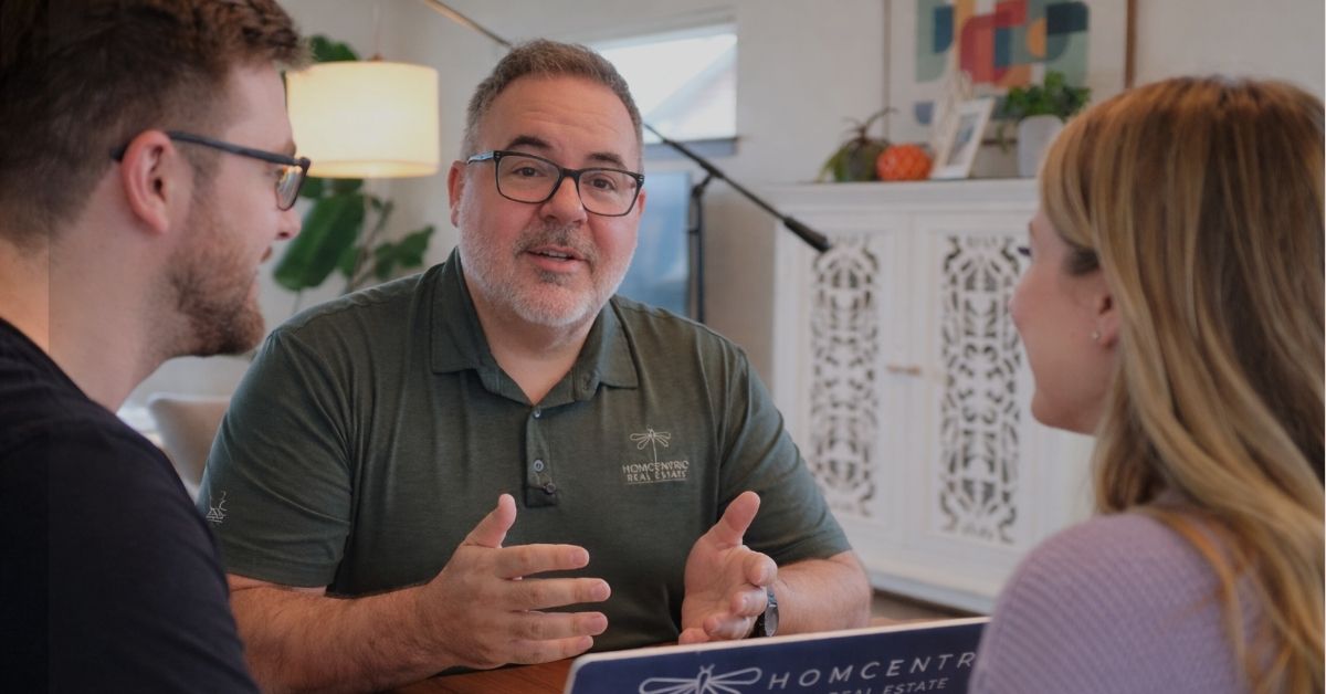 Eau Claire Realtor Brad Bemowski reviewing WHEDA loan program with first-time-buyers