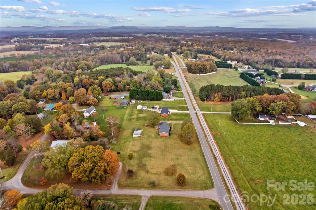 Aerial view of North Iredell County North Carolina showing spacious lots established homes and mountain views along Taylorsville Highway