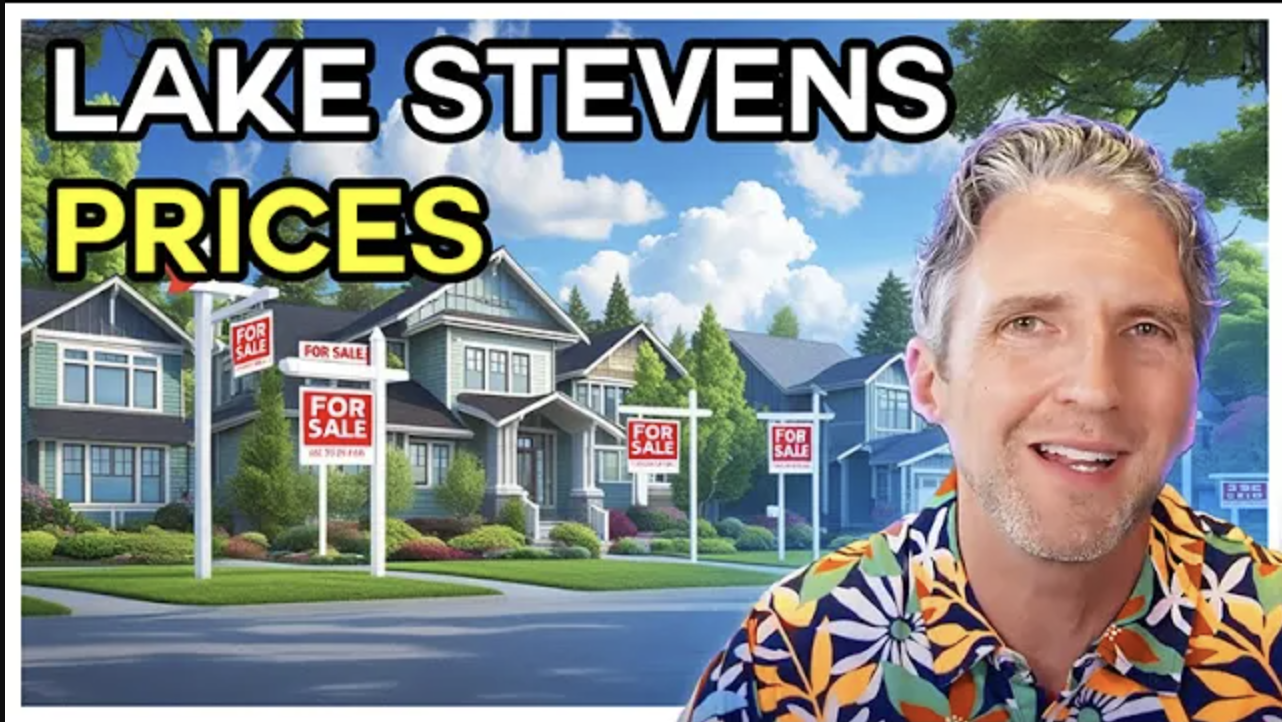 A smiling man in a colorful floral shirt stands in front of a neighborhood lined with houses displaying
