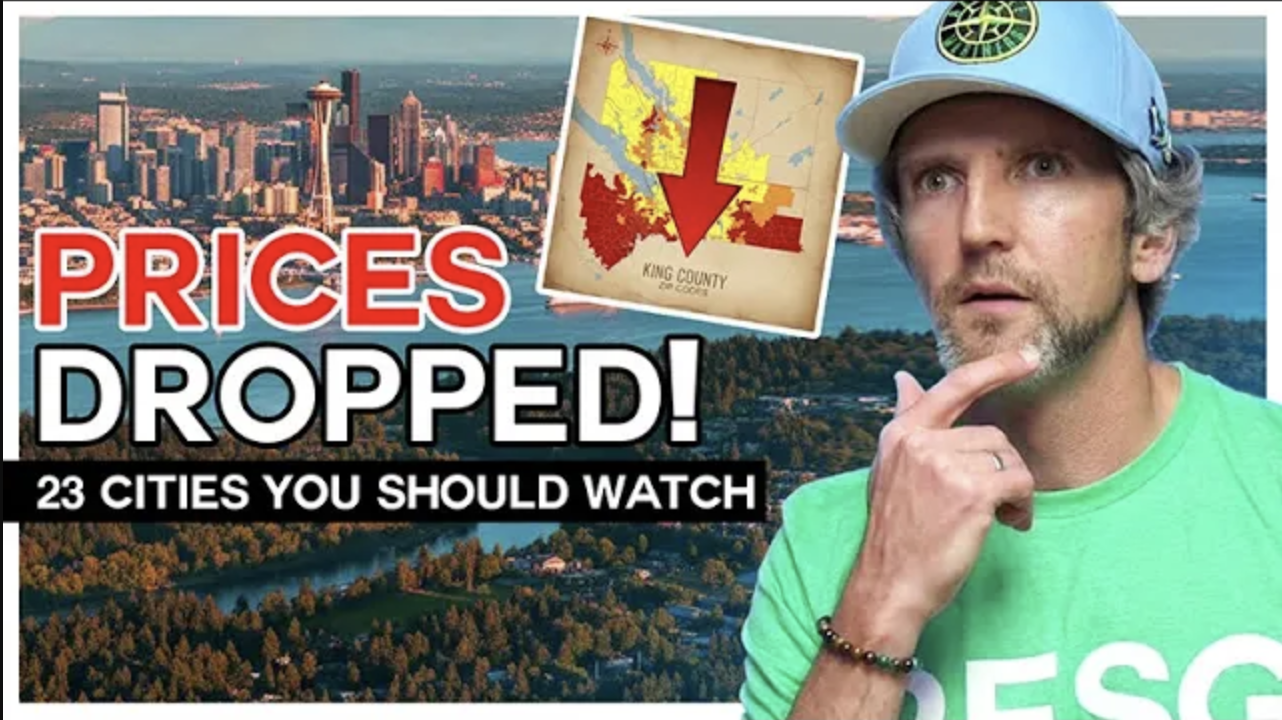 ouTube thumbnail showing the Seattle skyline and an aerial view of forests and water, with bold text “PRICES DROPPED!” and “23 CITIES YOU SHOULD WATCH.” An inset map of King County has a large red downward arrow. On the right, a man in a blue cap and green shirt looks concerned, hand on chin.
