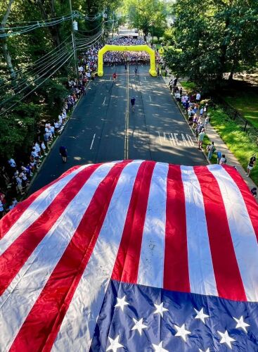 The 2026 Firecracker 4-Miler & Fun Run header image.