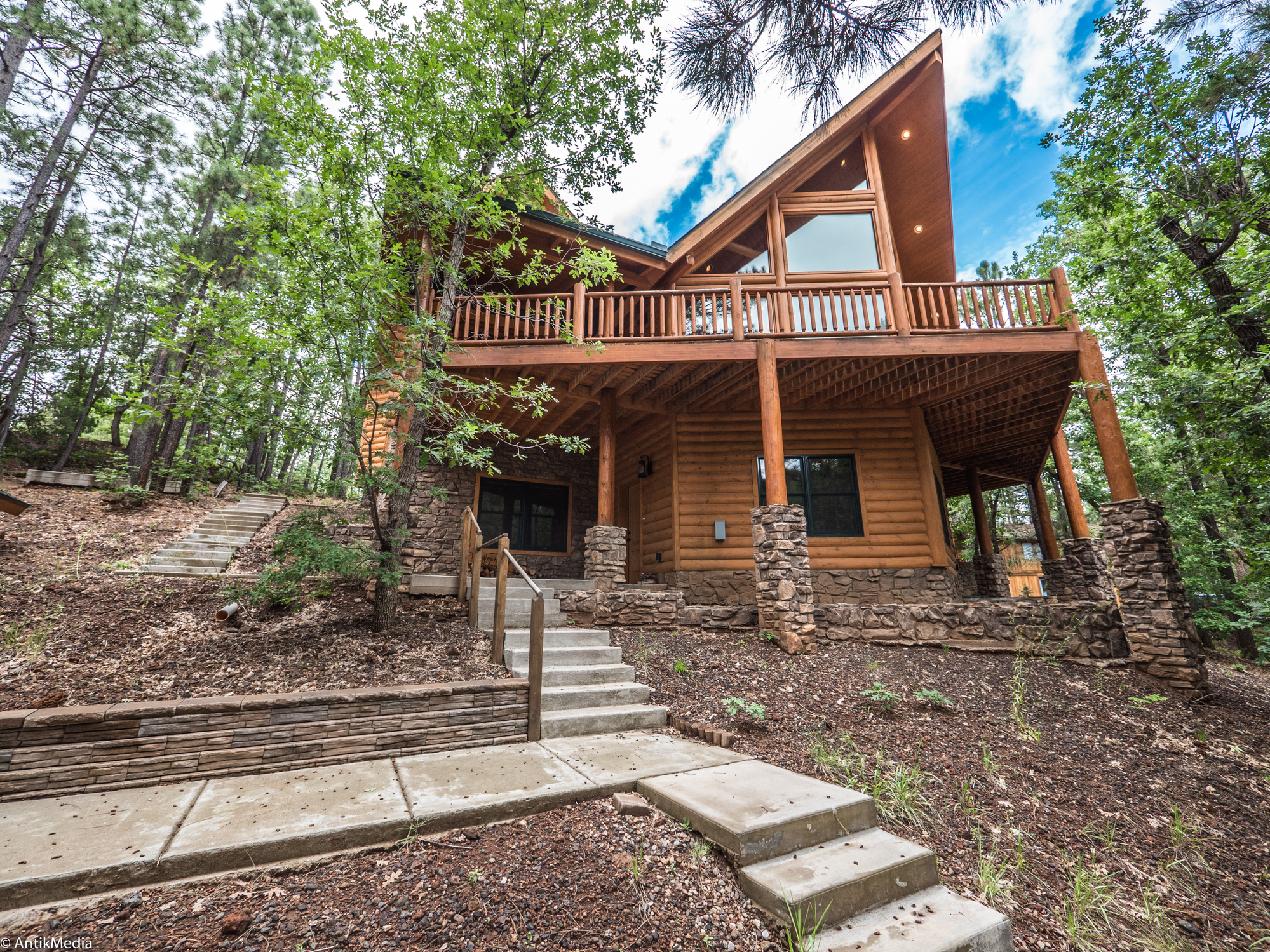 Your Pinetop AZ Getaway: 5 Bed 4 Bath 3 Story Custom Log Home Sleeps Up To 20! header image.
