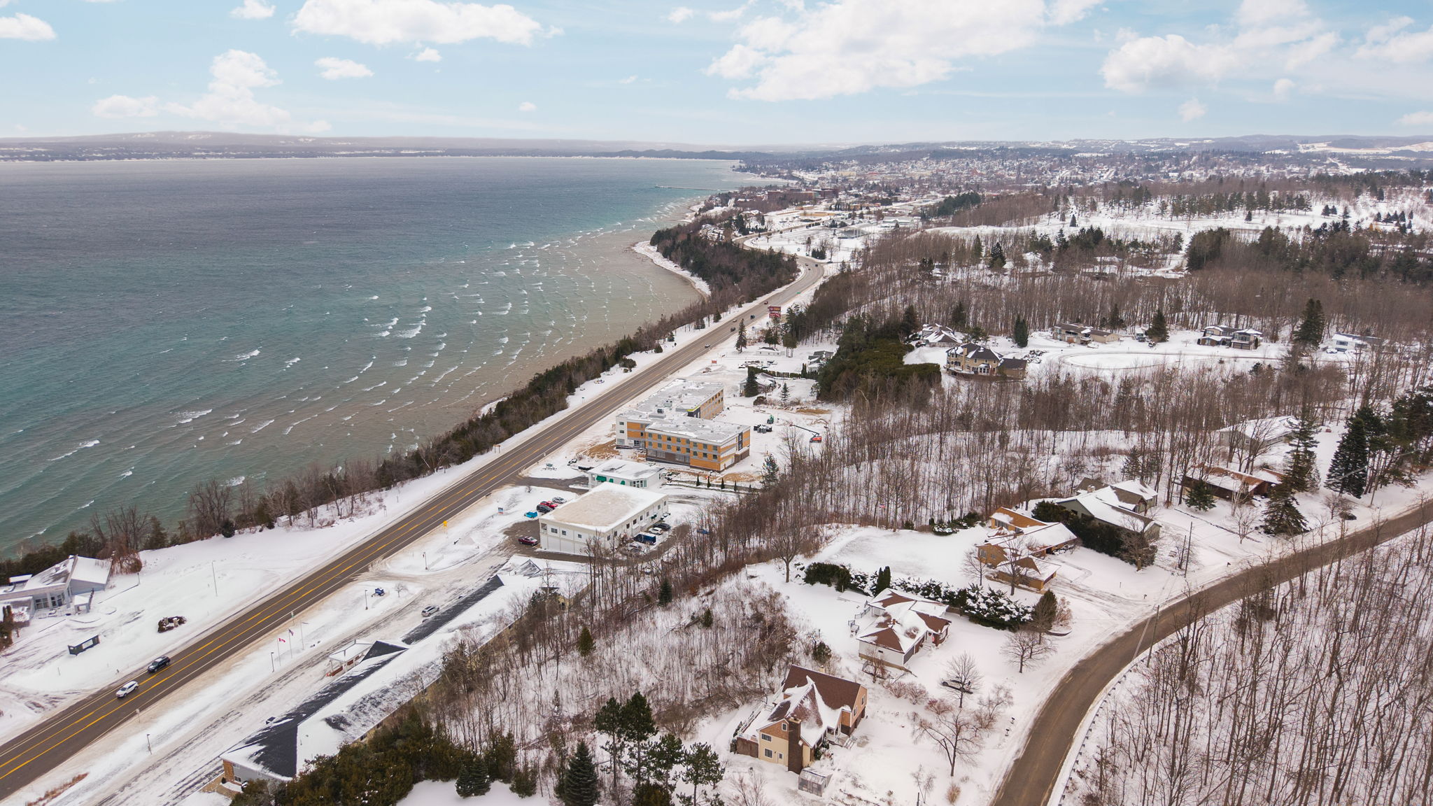 Snow covered roads and Lake Michigan shoreline.
