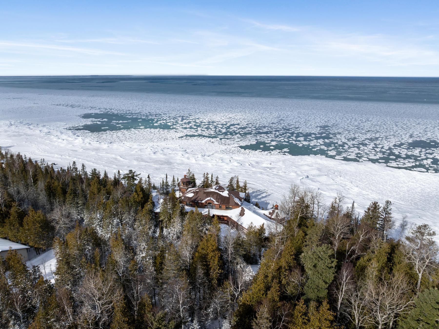 Luxury Northern Michigan home with winter shoreline