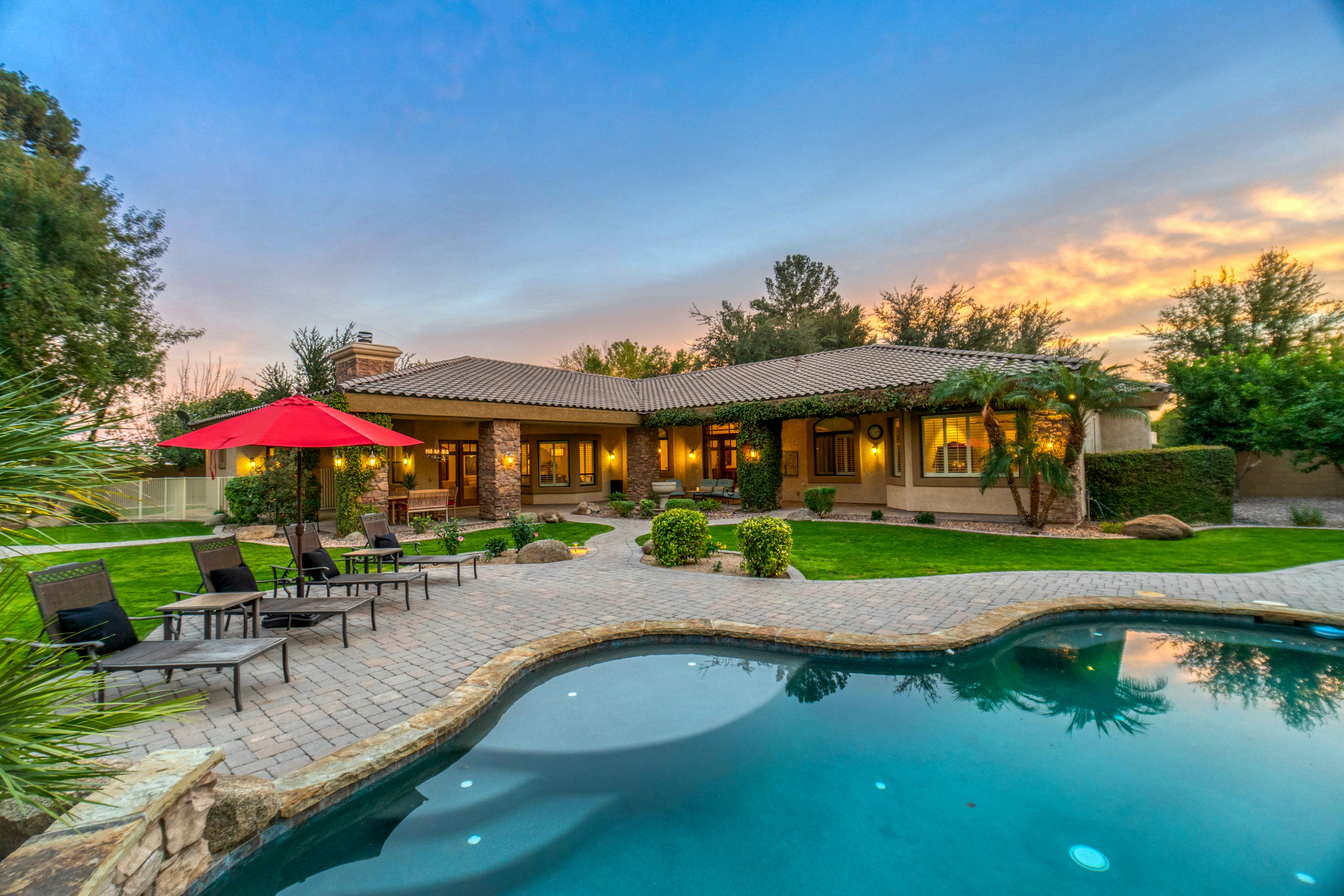 luxury home with an inground pool