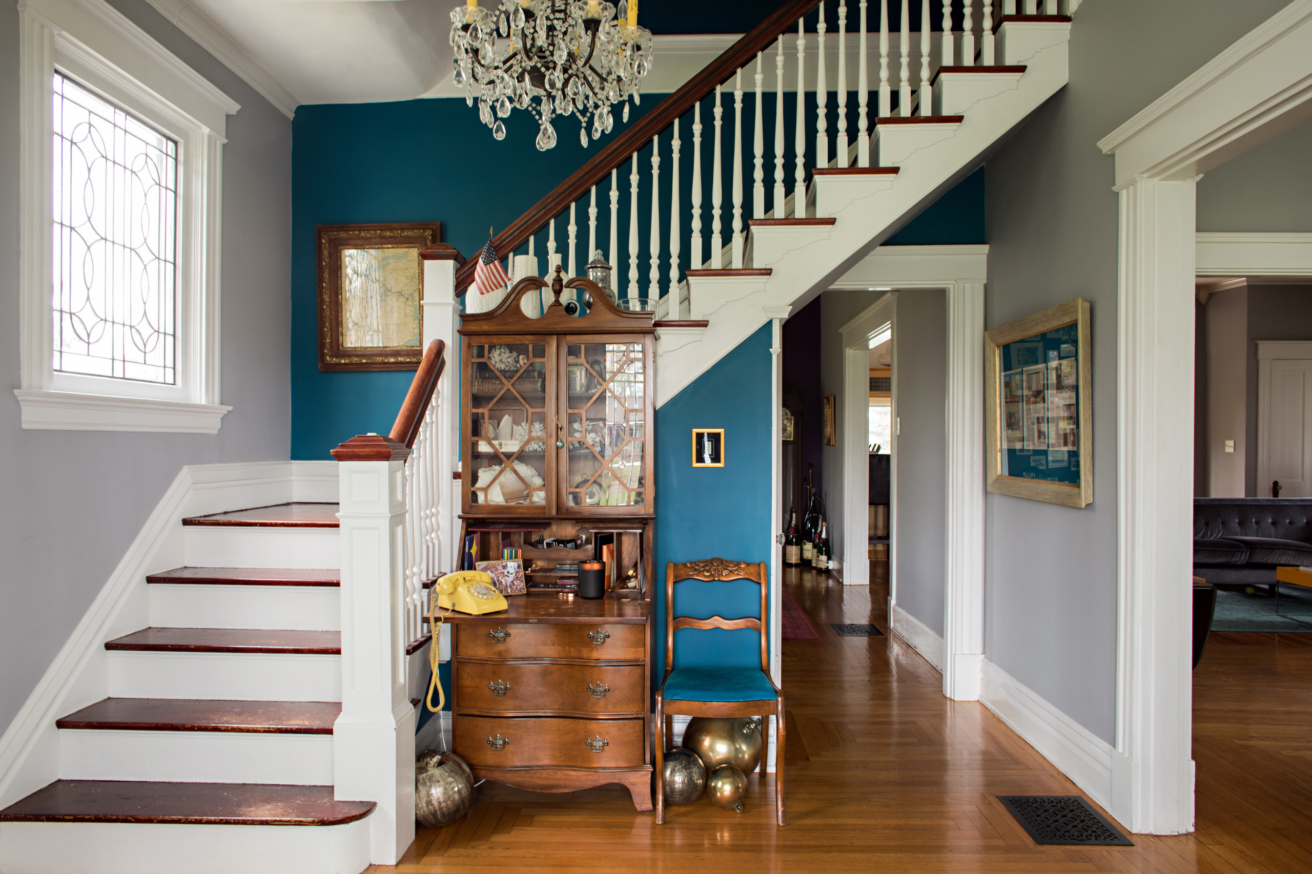 Historic home staircase,teal wall