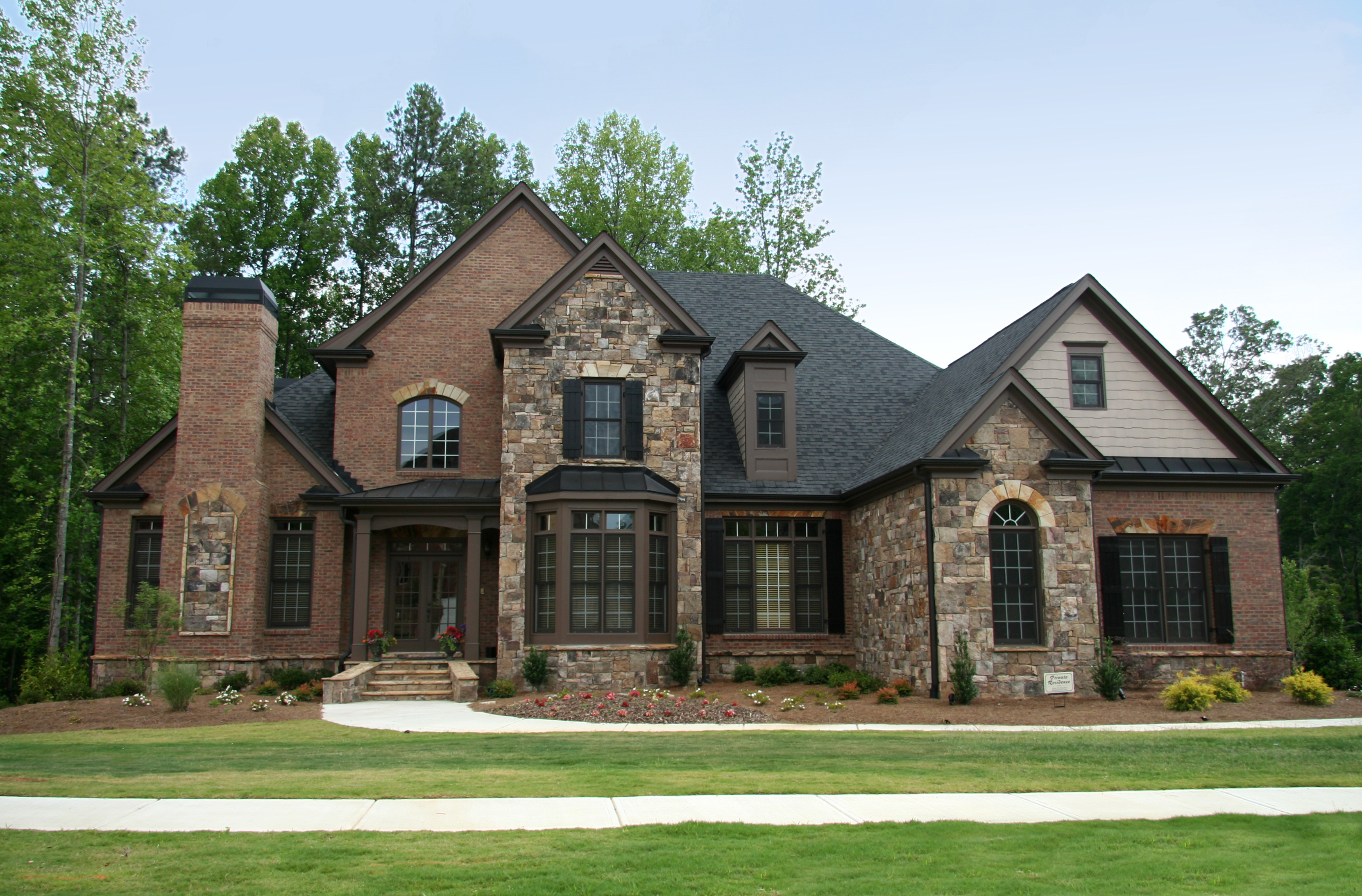 two story luxury home brown brick