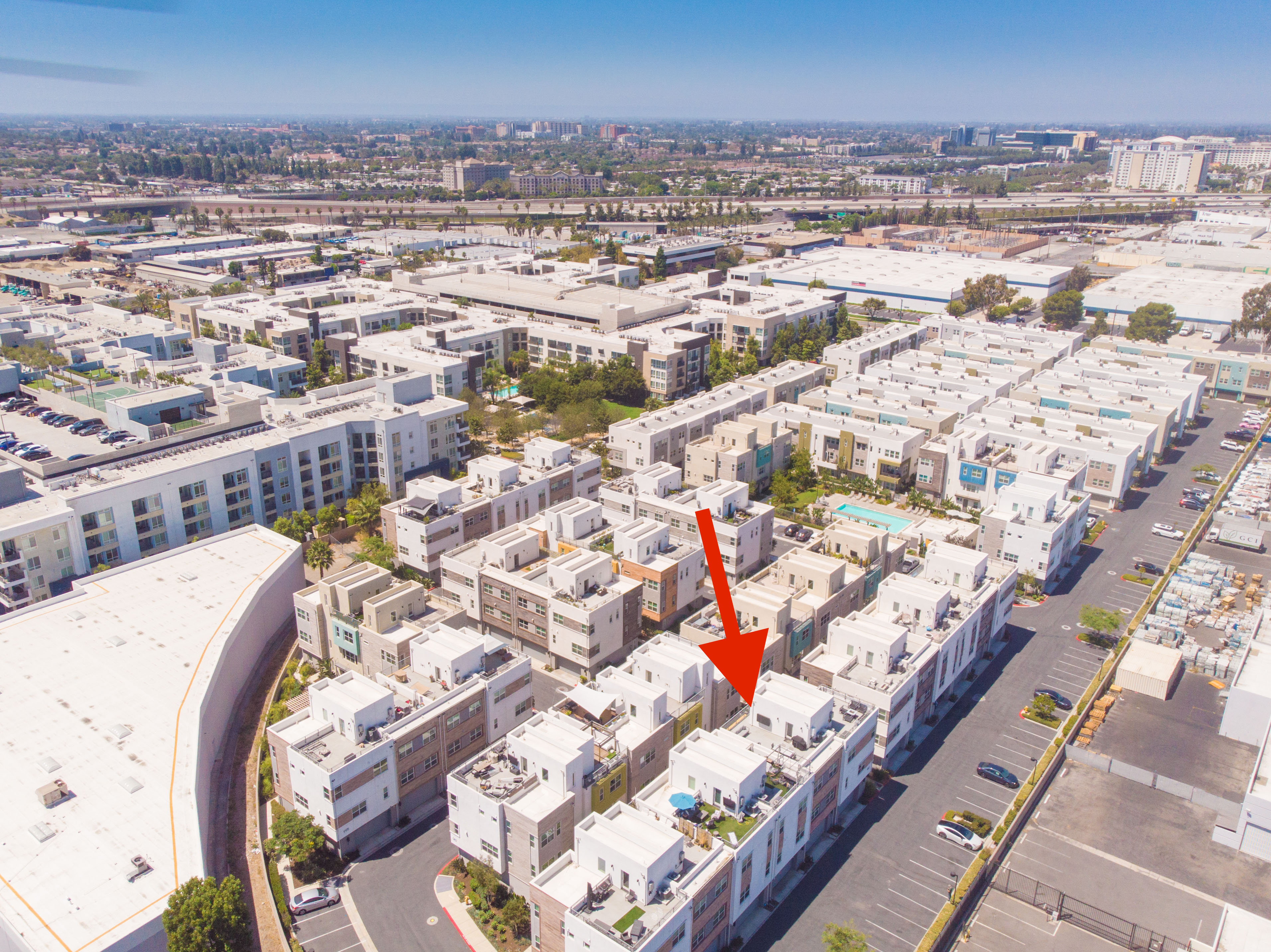 Aerial view of Anaheim's Platinum Triangle showing the residential community surrounding 983 E Mason Lane #123 and nearby urban development.