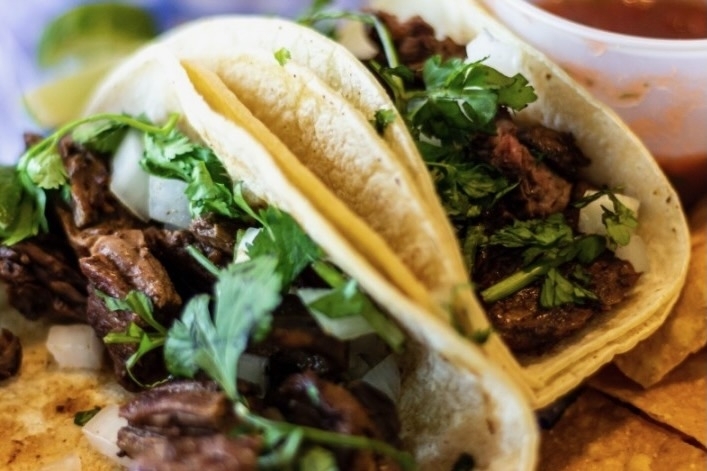 Tacos El Sabor Callejero now serving Mexican cuisine in Kingwood By Community Impact header image.