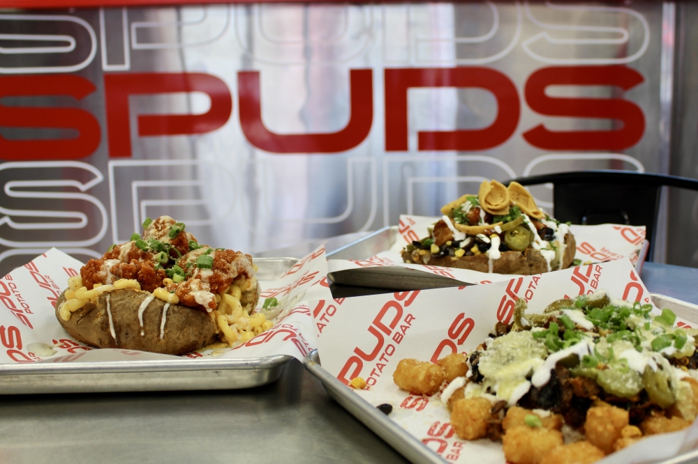 Spuds Potato Bar offers personalized loaded potatoes in Montgomery By Community Impact header image.