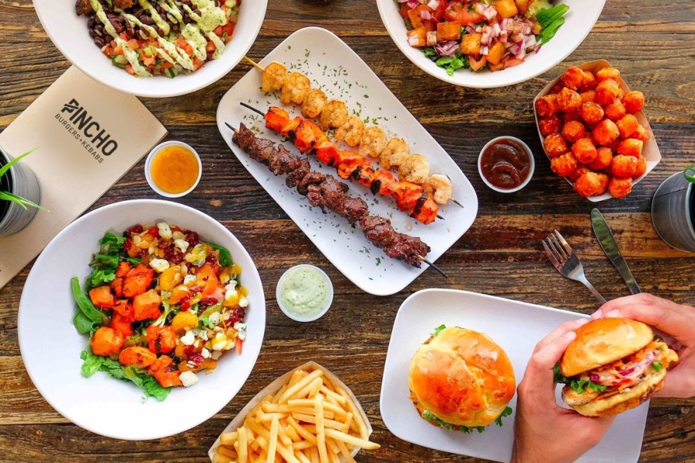 Pincho Burgers + Kebabs opens Katy restaurant By Community Impact header image.