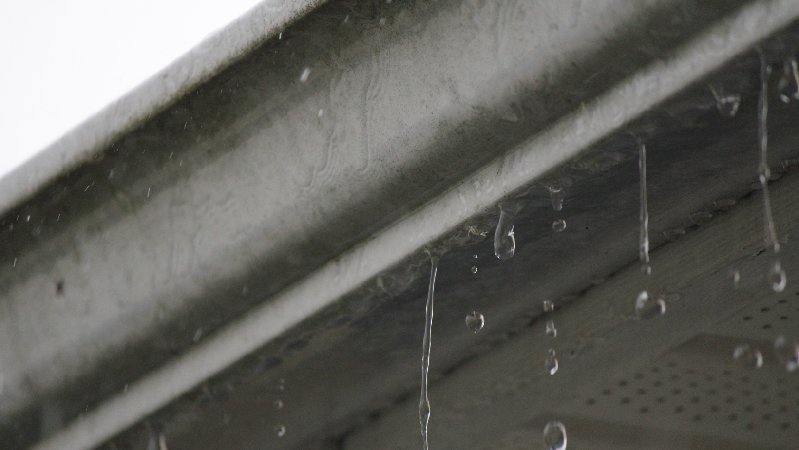 Considering Seamless Gutters? By HomeKeepr header image.