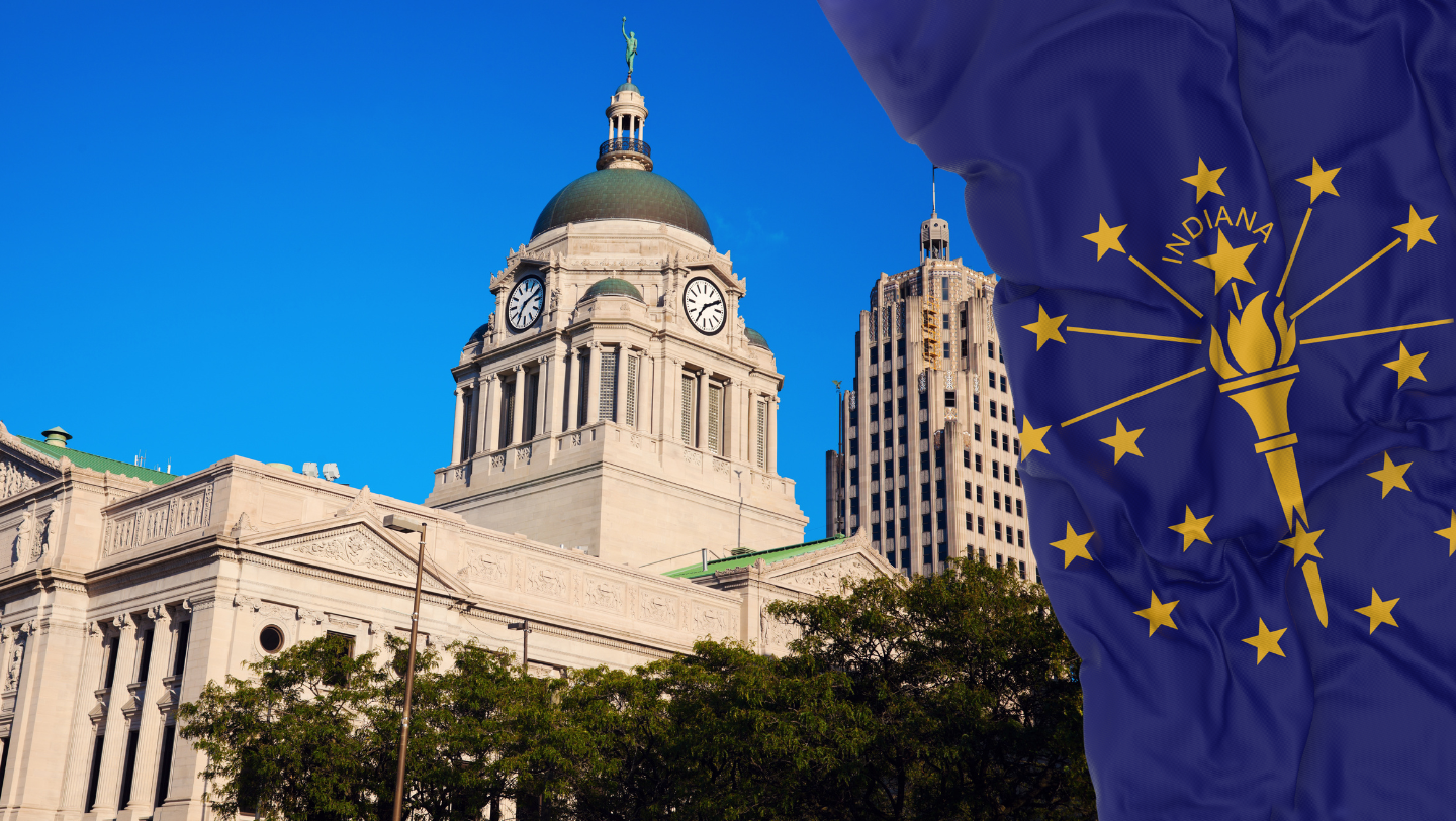 Allen County Courthouse and Lincoln Tower in downtown Fort Wayne with the Indiana state flag waving at right