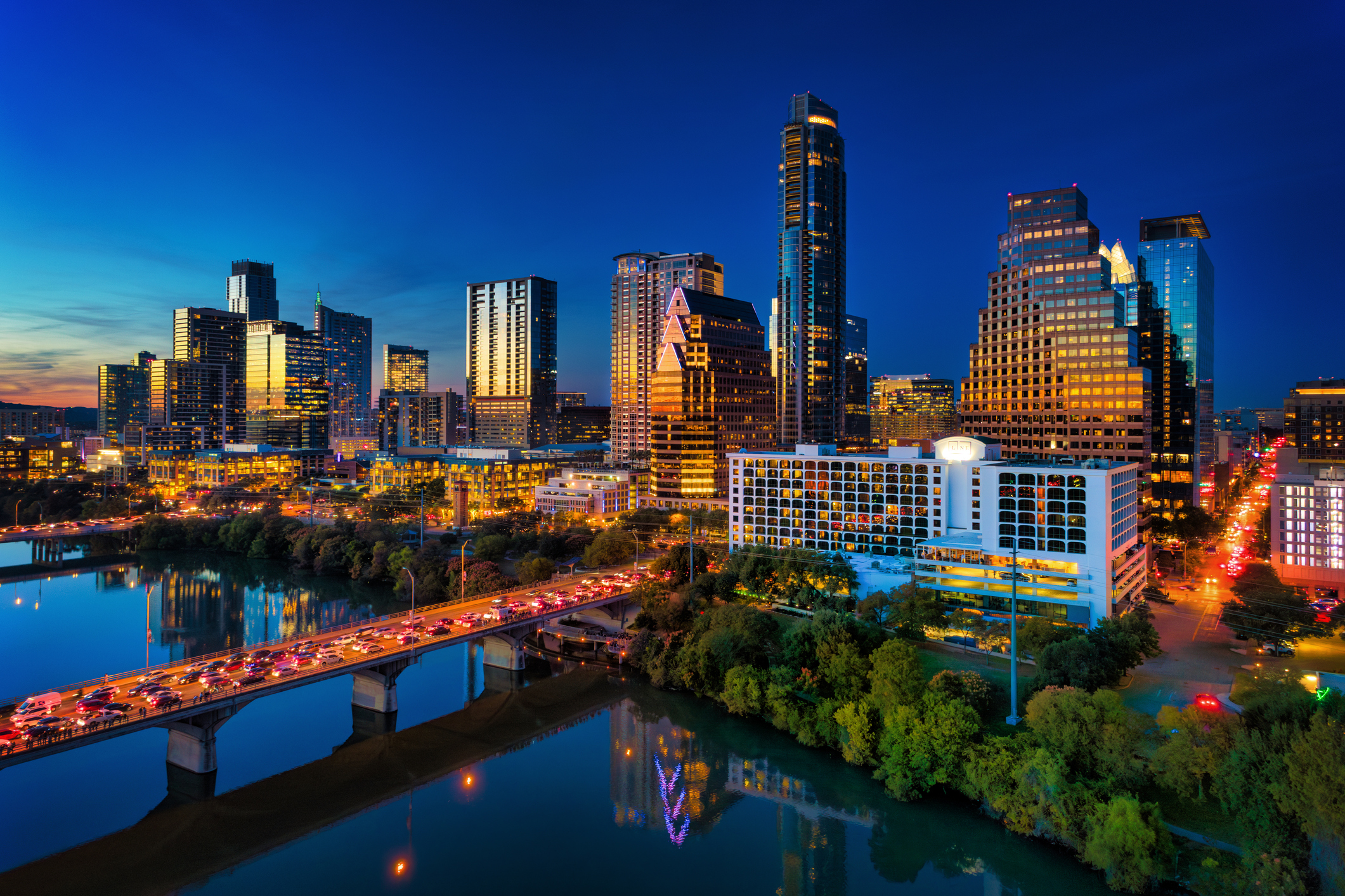 Austin skyline at sunset with modern downtown buildings and the Colorado River