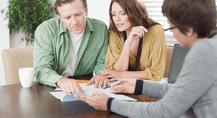 Homeowner reviewing rising home value trends on a laptop.