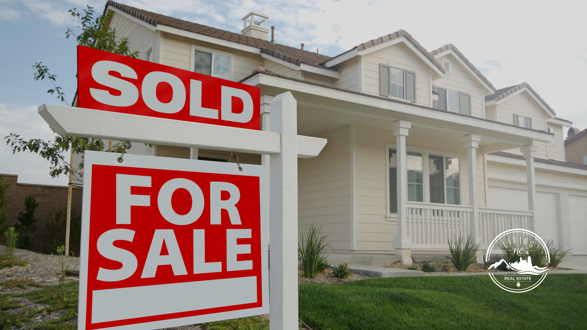 Homeowners celebrating the sale of their North Carolina home after a successful closing.