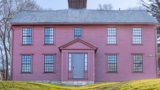 Historic pink-painted New England colonial home with classic center-entry symmetry — representative of the pre-1939 historic architecture in the Crown Hill Nashua NH neighborhood