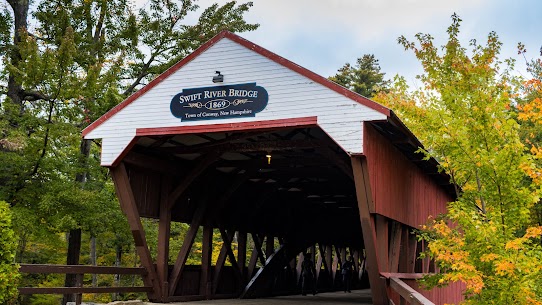 Historic Swift River covered bridge in Conway, New Hampshire — a quintessential small-town scene for retirees considering the best New Hampshire towns to retire in
