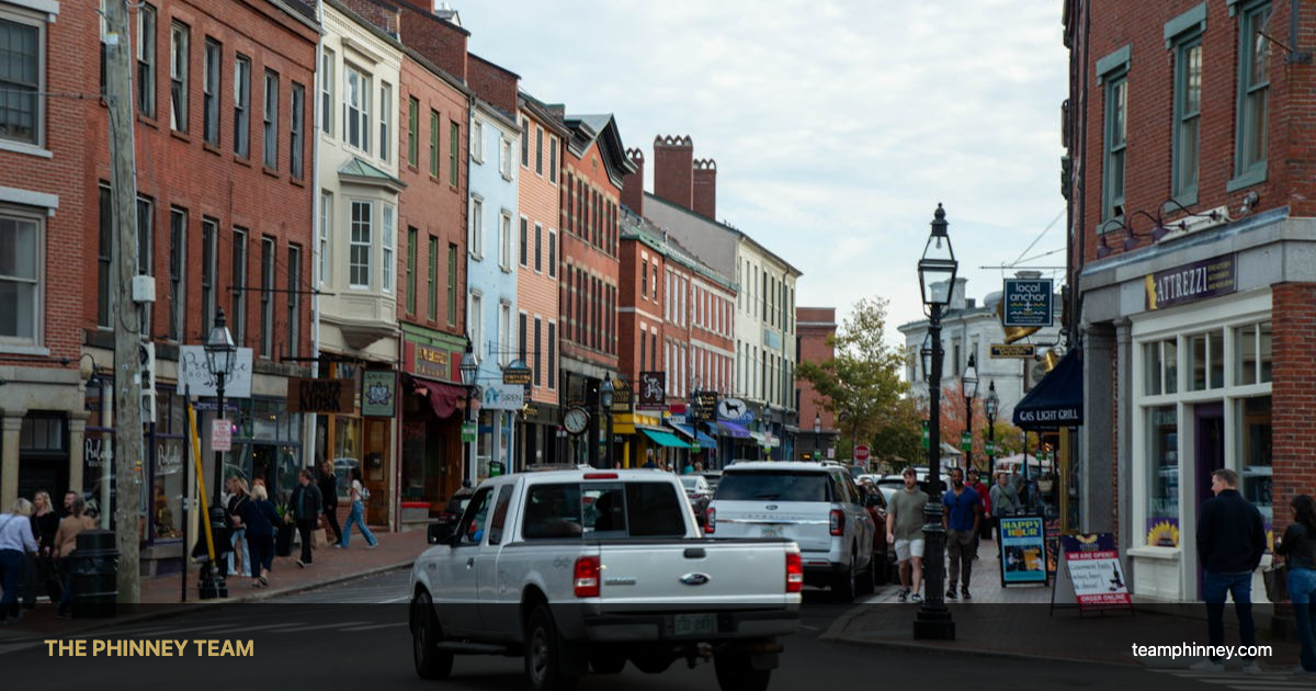 Homes for sale in Nashua NH - residential street with New England architecture in spring 2026