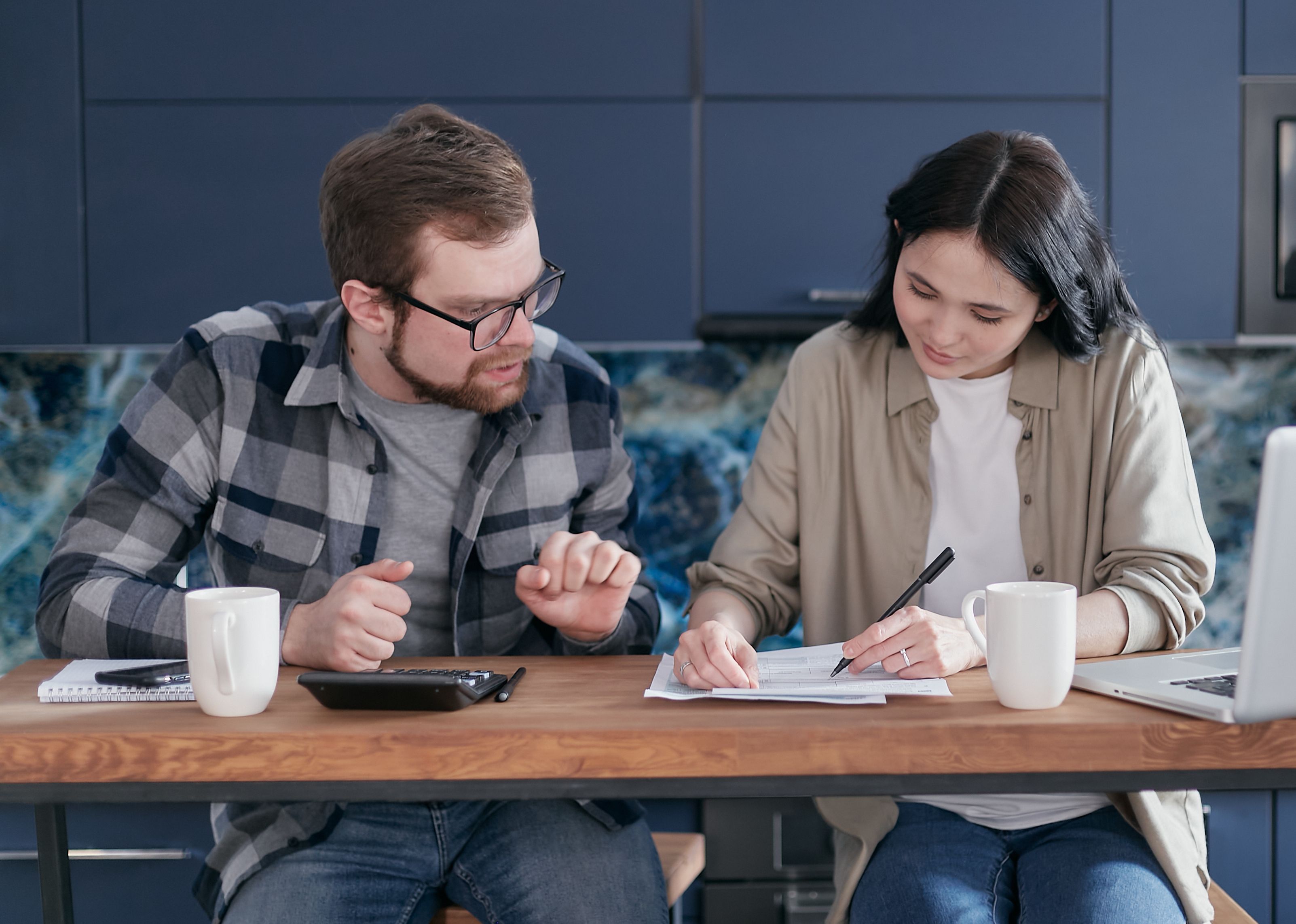 Couple at table going over a budget