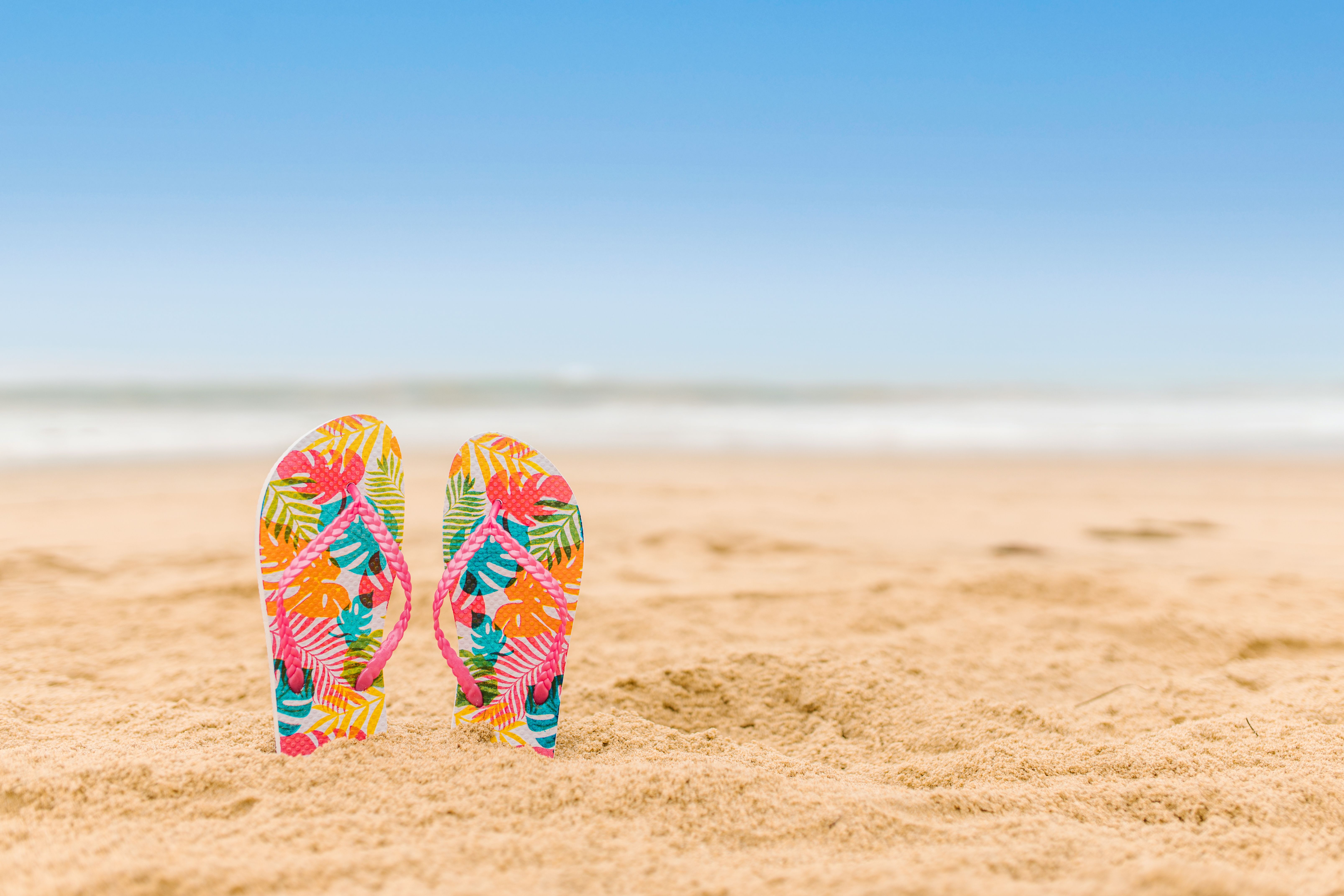 Sandals in the sand on the beach