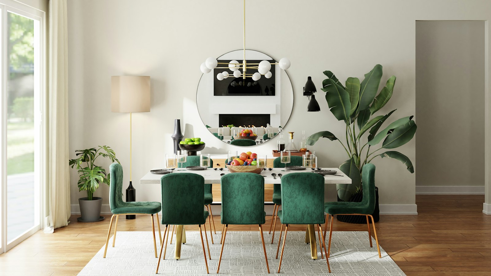 Bright modern dining room with emerald velvet chairs, white table, brass sputnik chandelier, and glass doors onto greenery