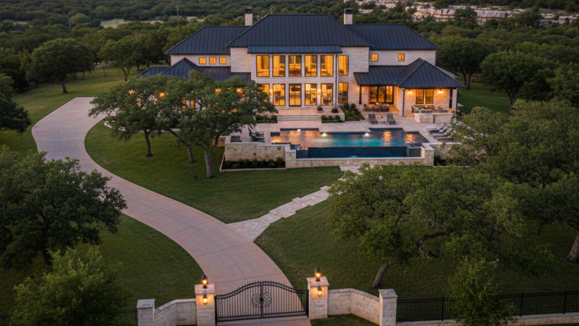 Luxury Hill Country home in Boerne TX at sunset with pool and expansive views in 78006