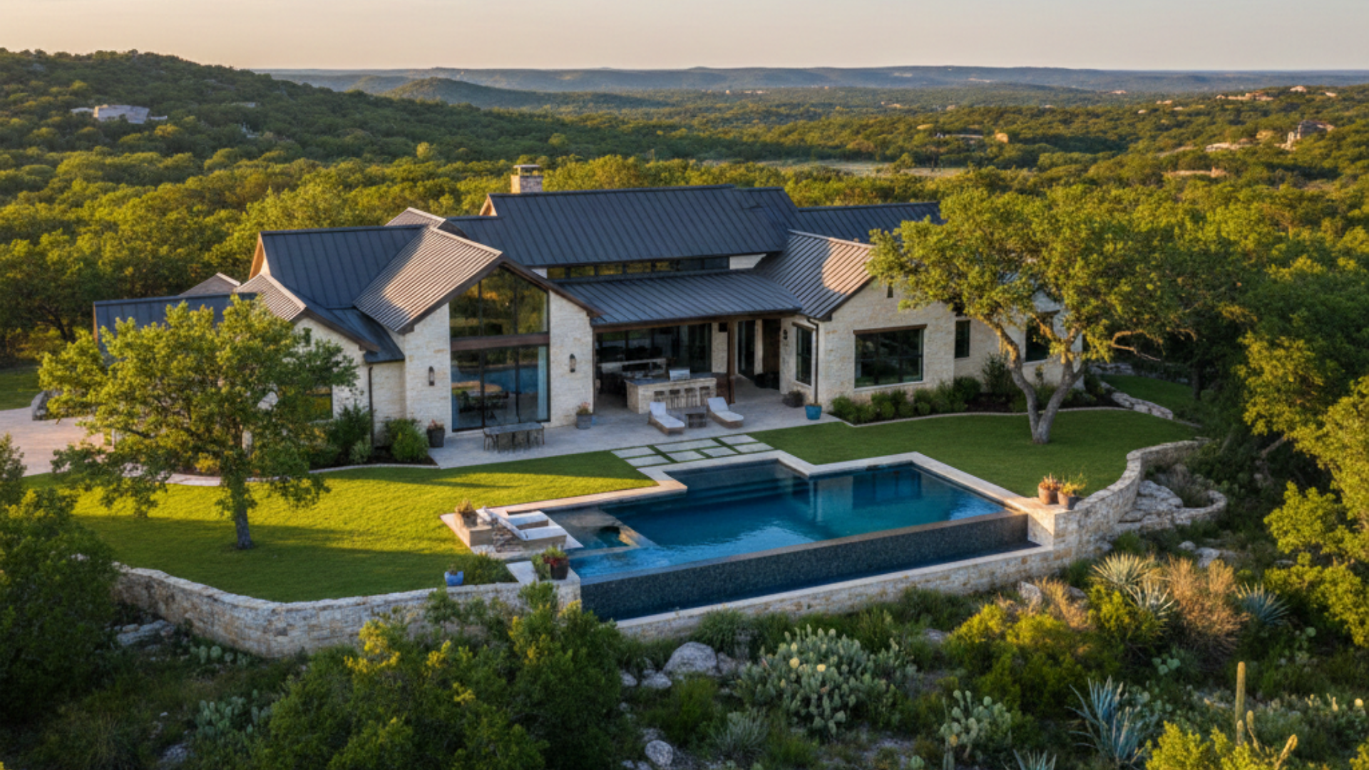 Luxury Hill Country home in Boerne TX with expansive patio, pool, and scenic views in the 78006 zip code