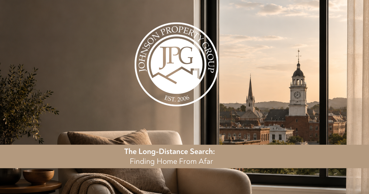 Johnson Property Group branded relocation graphic showing a bright neutral home interior with moving boxes, keys, and a laptop displaying a home search, representing buying a home from afar.