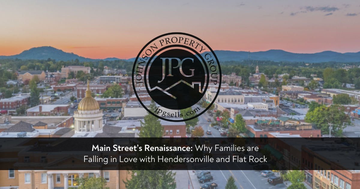 Elevated drone view of downtown Hendersonville, North Carolina during a golden hour sunset, highlighting the historic brick architecture, wide sidewalks, and vibrant streetscape against the Blue Ridge Mountains