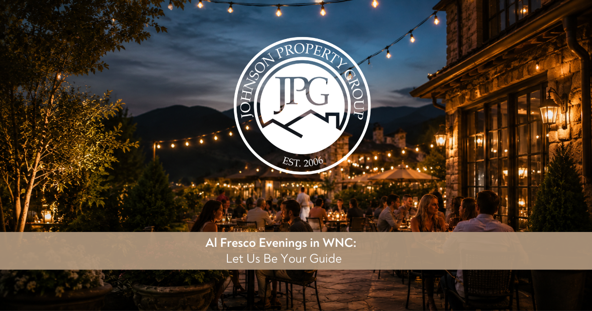 Johnson Property Group branded lifestyle image showing an elegant outdoor dining setup at golden hour in Western North Carolina with warm lighting, greenery, and a relaxed luxury feel.