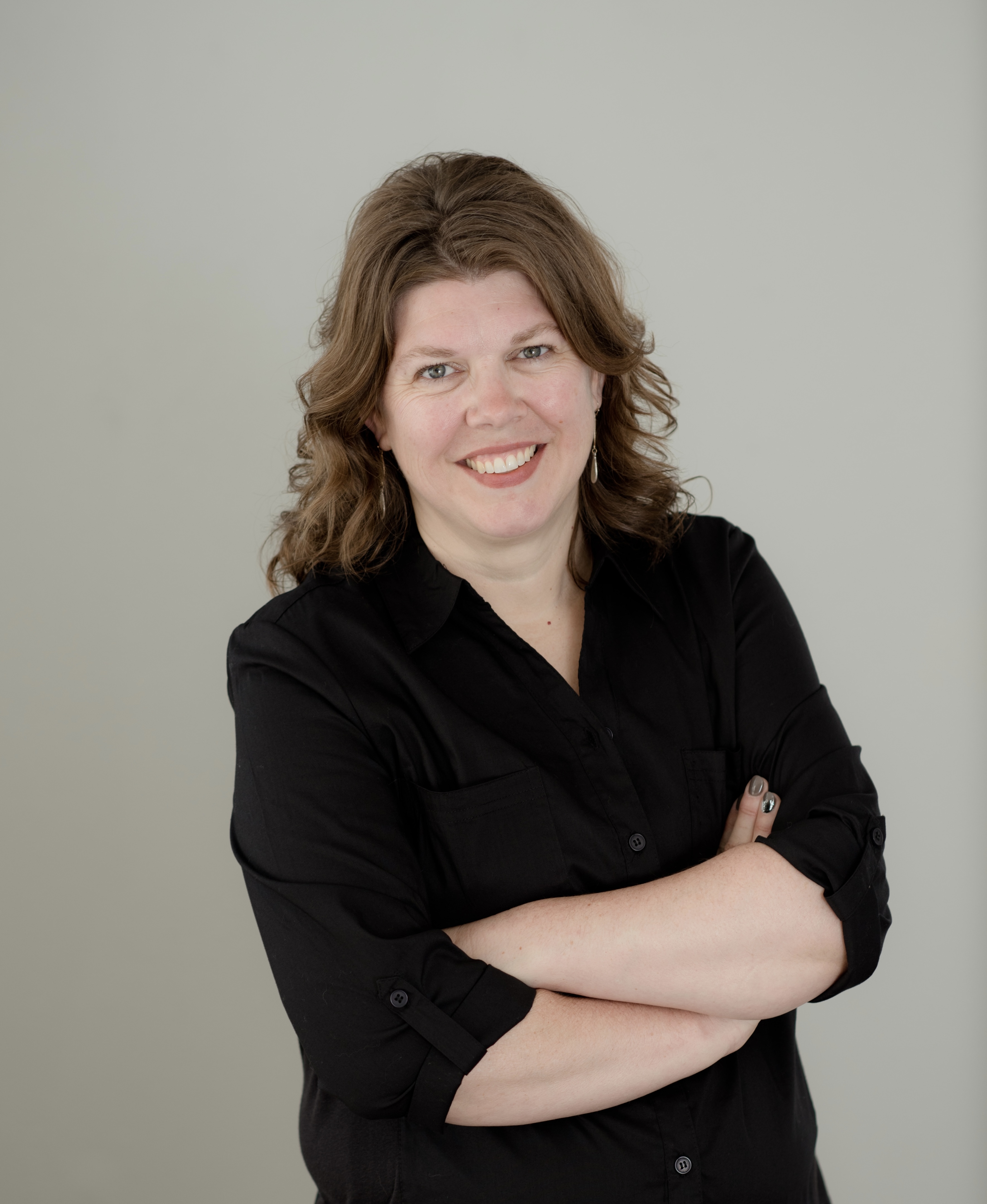 “Tiffani Smith, trusted Correctionville, IA real estate professional, smiling in her headshot.”