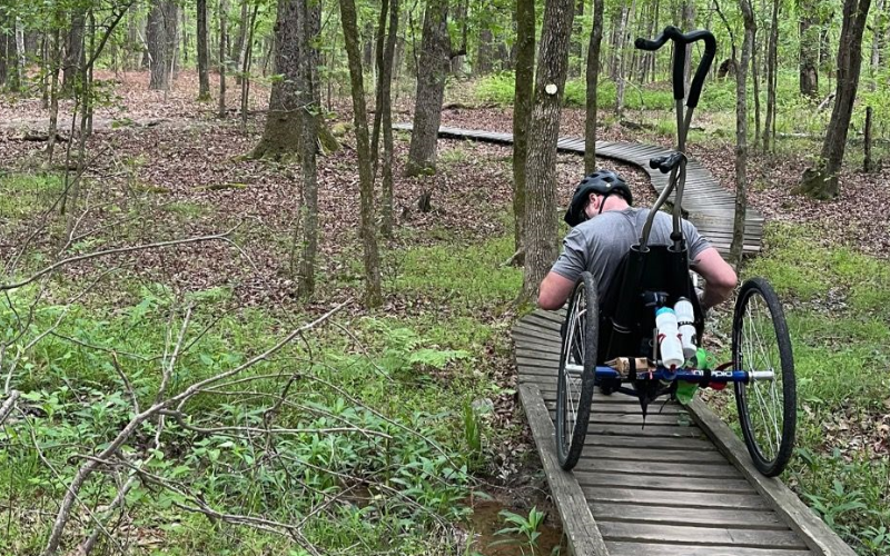 Man in wheelchair on trail