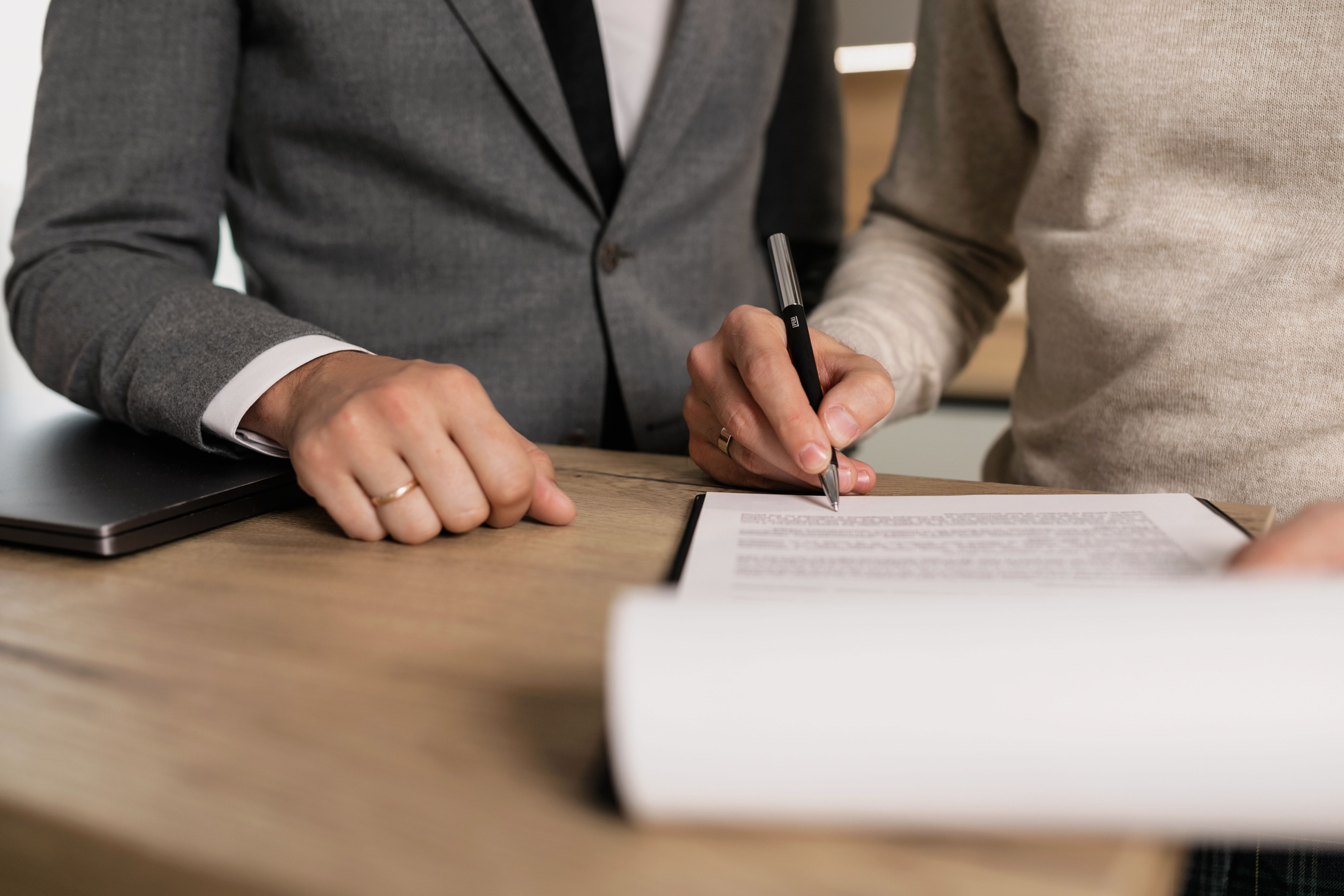 Closing table document signing during a Baltimore home sale
