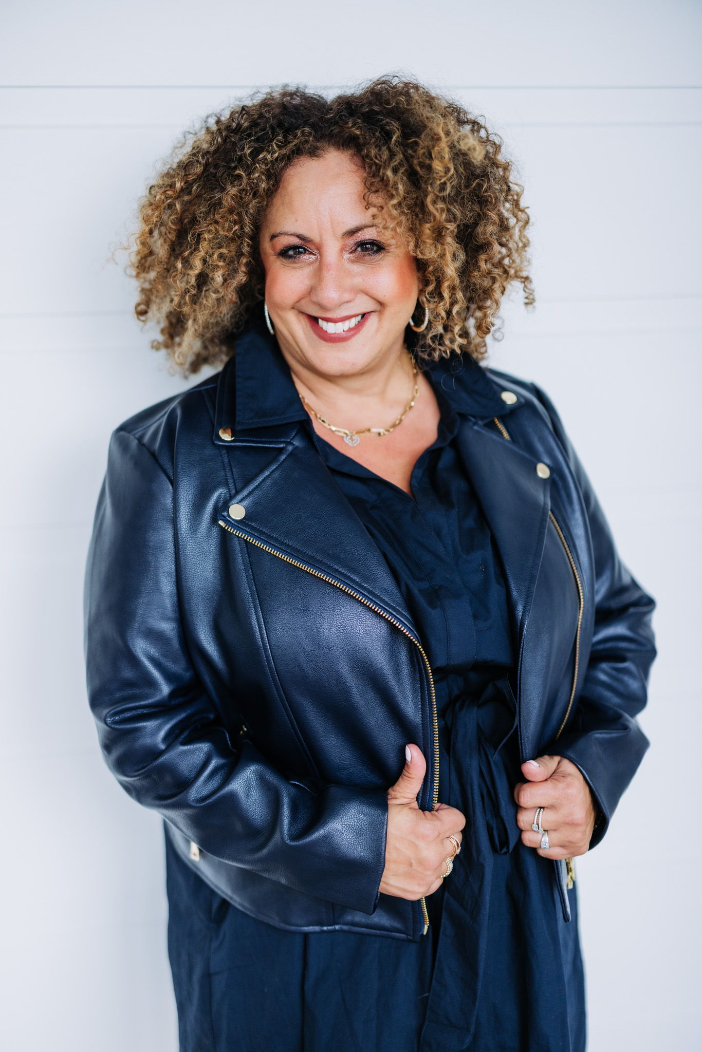 Melina Bradley in a blue leather jacket
