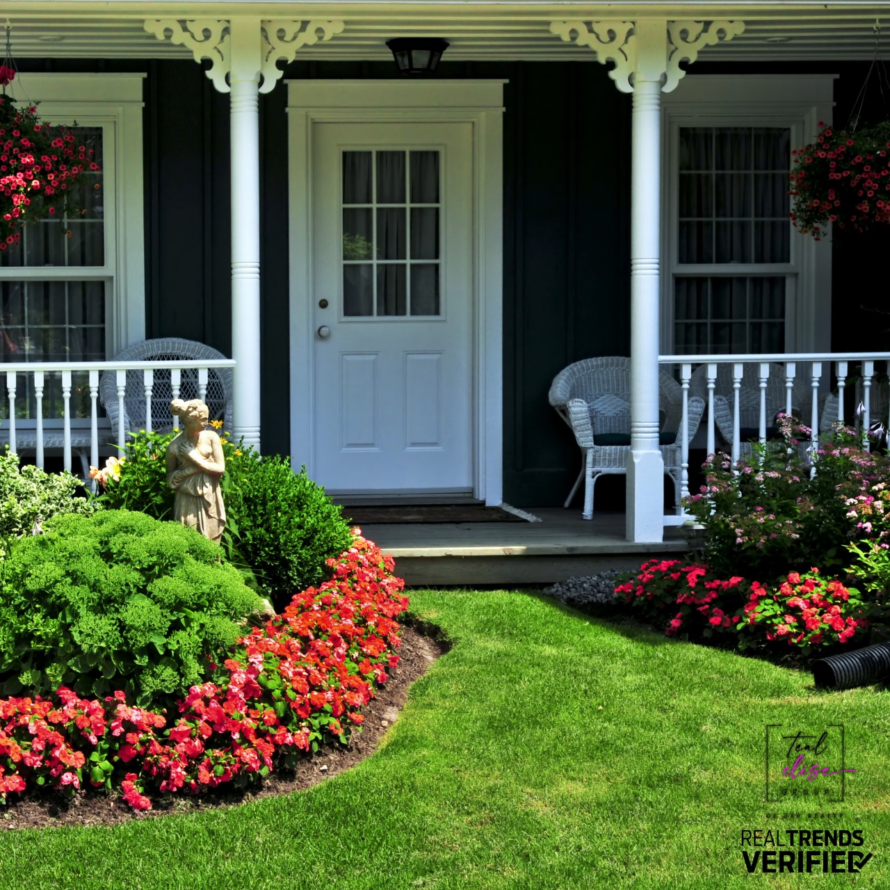 Beautifully maintained front porch with white trim, wicker chairs, and vibrant landscaping, showcasing strong curb appeal for a Maryland home listing.