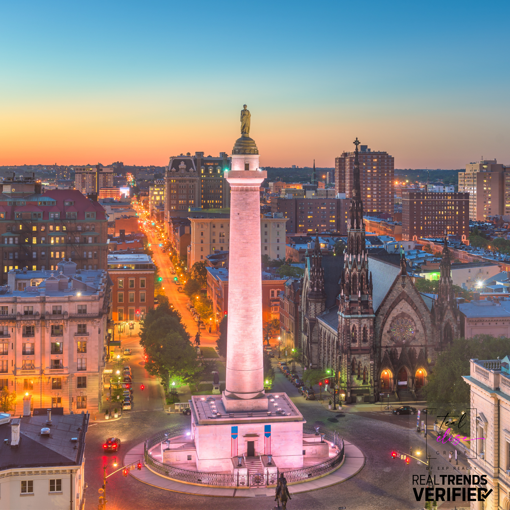 Sunset view of Baltimore’s Washington Monument in Mount Vernon, surrounded by historic buildings and city lights.