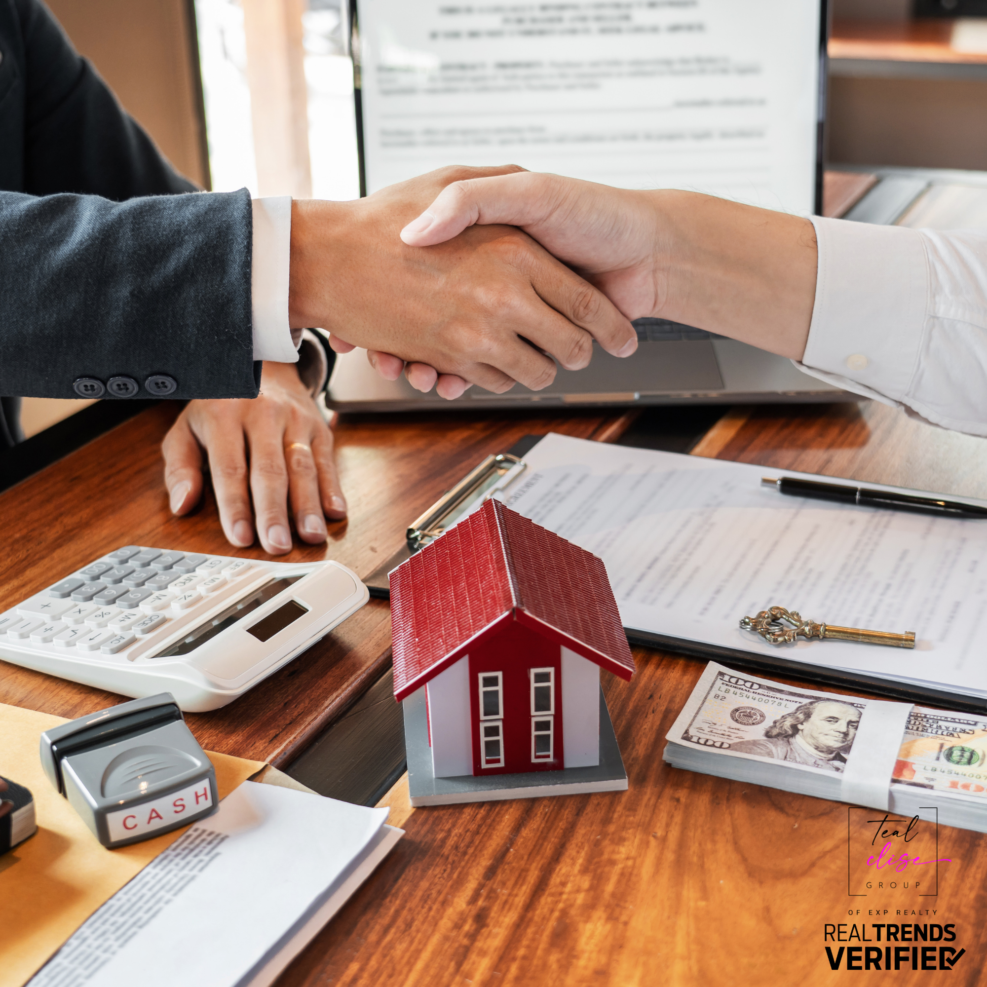 A Maryland home seller and buyer shaking hands over a signed purchase agreement, symbolizing an accepted offer.