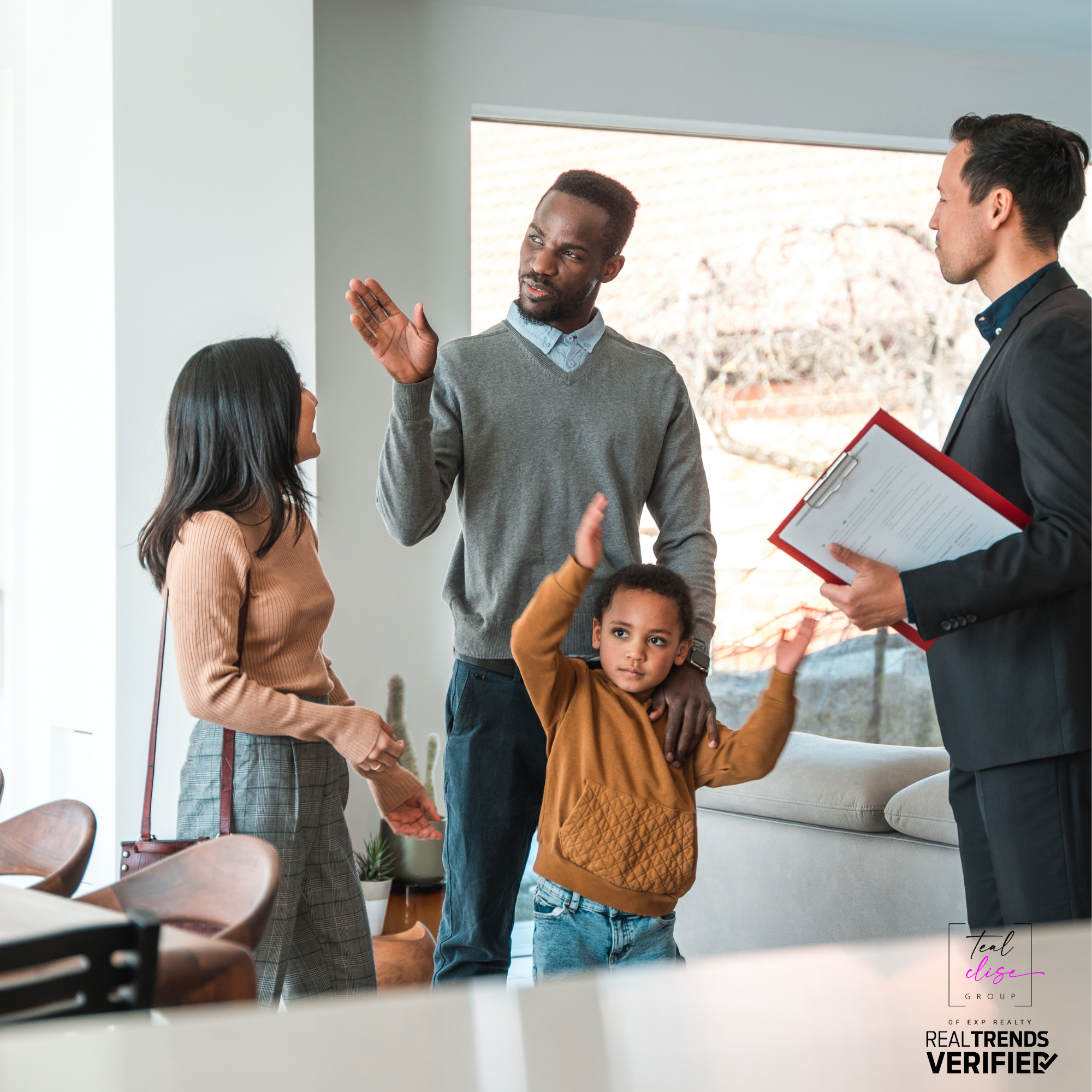 Young family touring a modern home with a real estate agent holding a clipboard. The child gestures playfully while the parents engage with the agent. Image represents buyer psychology and home showings in the Maryland real estate market.