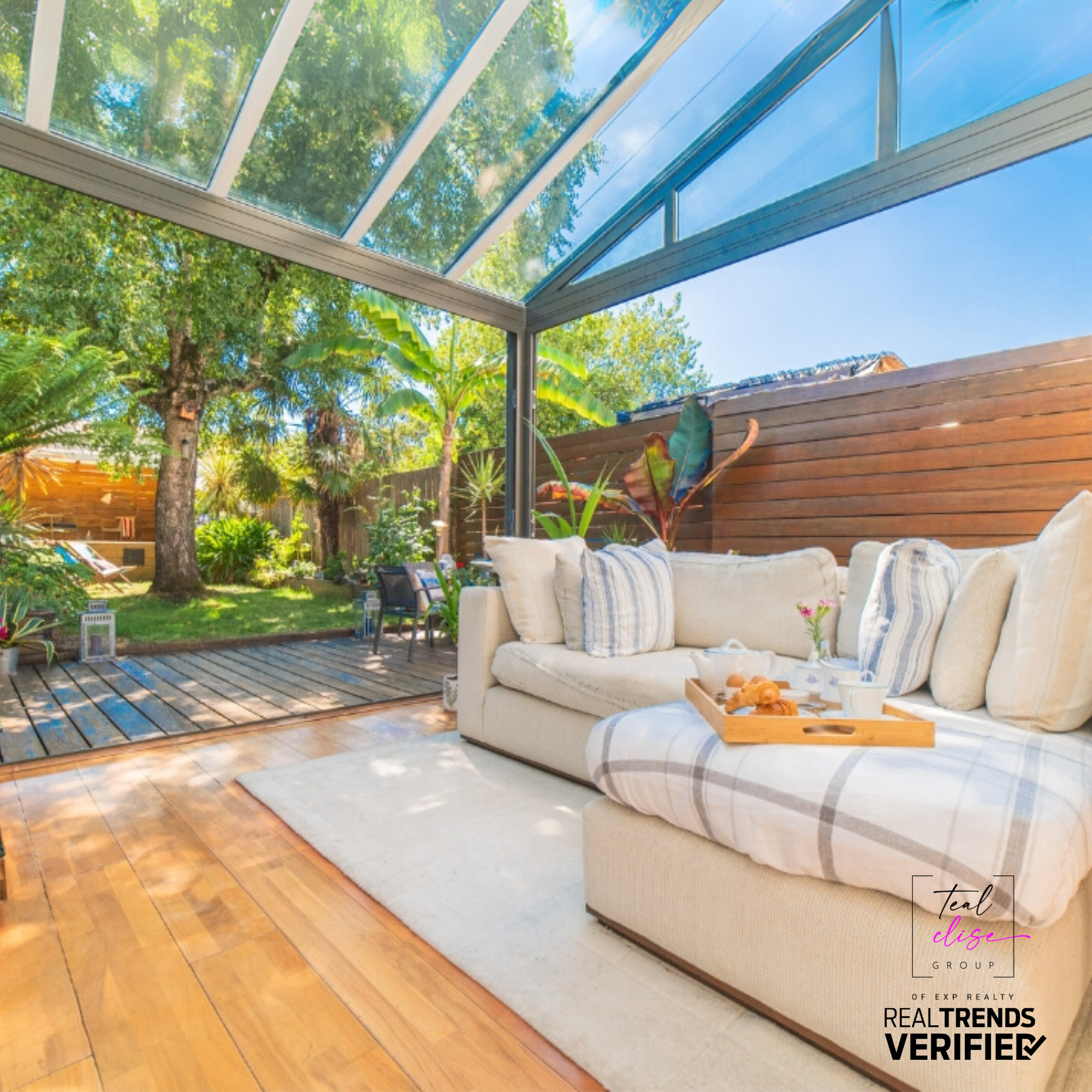 Beautifully staged house with a summer vibe, featuring a welcoming porch, and lush green landscaping—perfect for attracting Maryland home buyers.